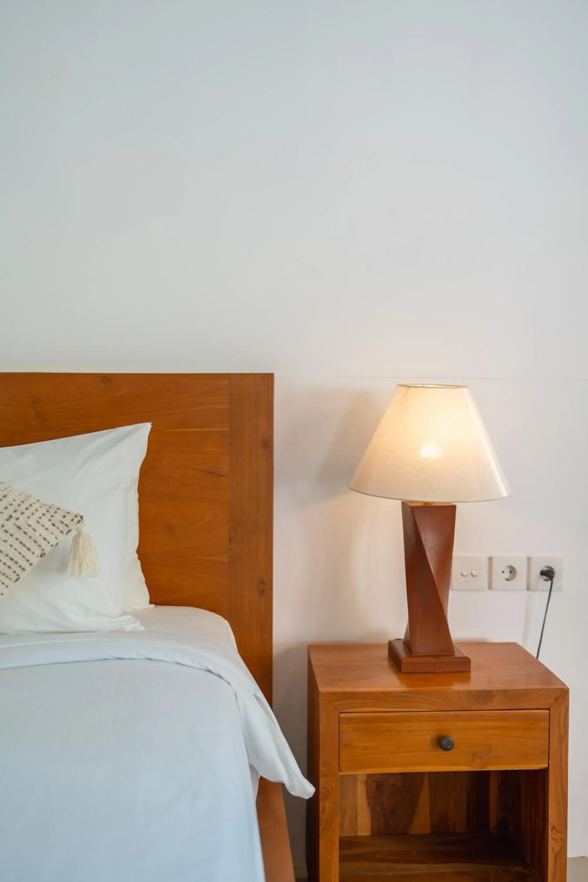 Bed in Nusa Indah Onai Hotel