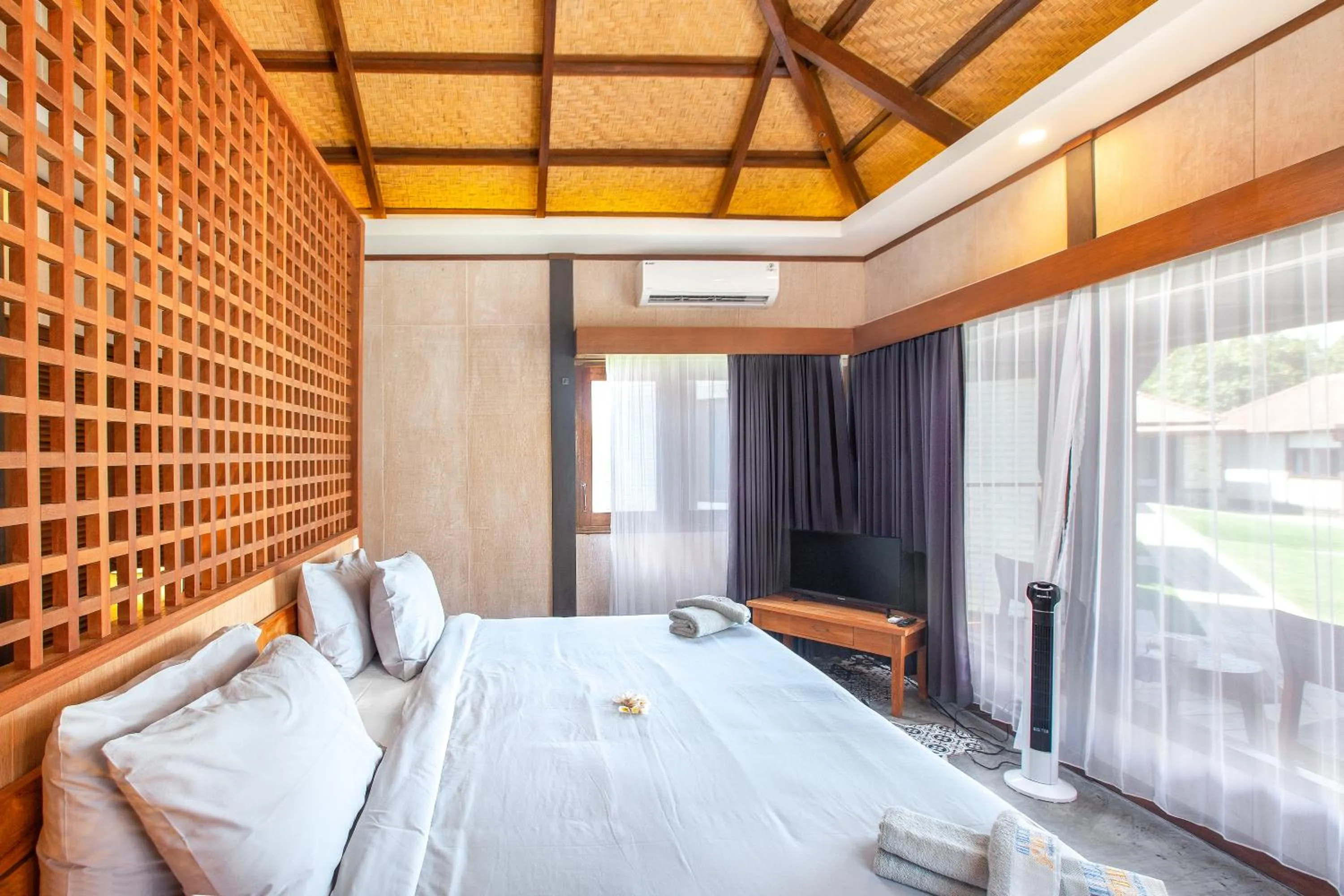 Bed in Hi Blue Bali Melasti Dive Resort