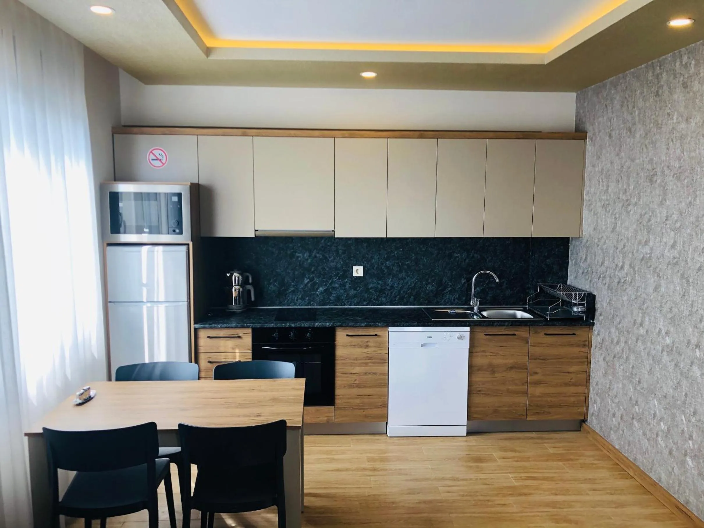 Kitchen or kitchenette in Golden World Suite Hotel
