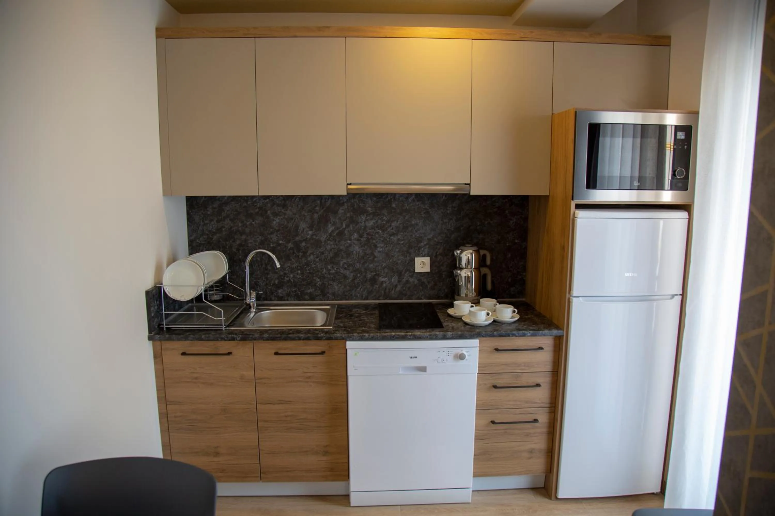 Kitchen or kitchenette in Golden World Suite Hotel