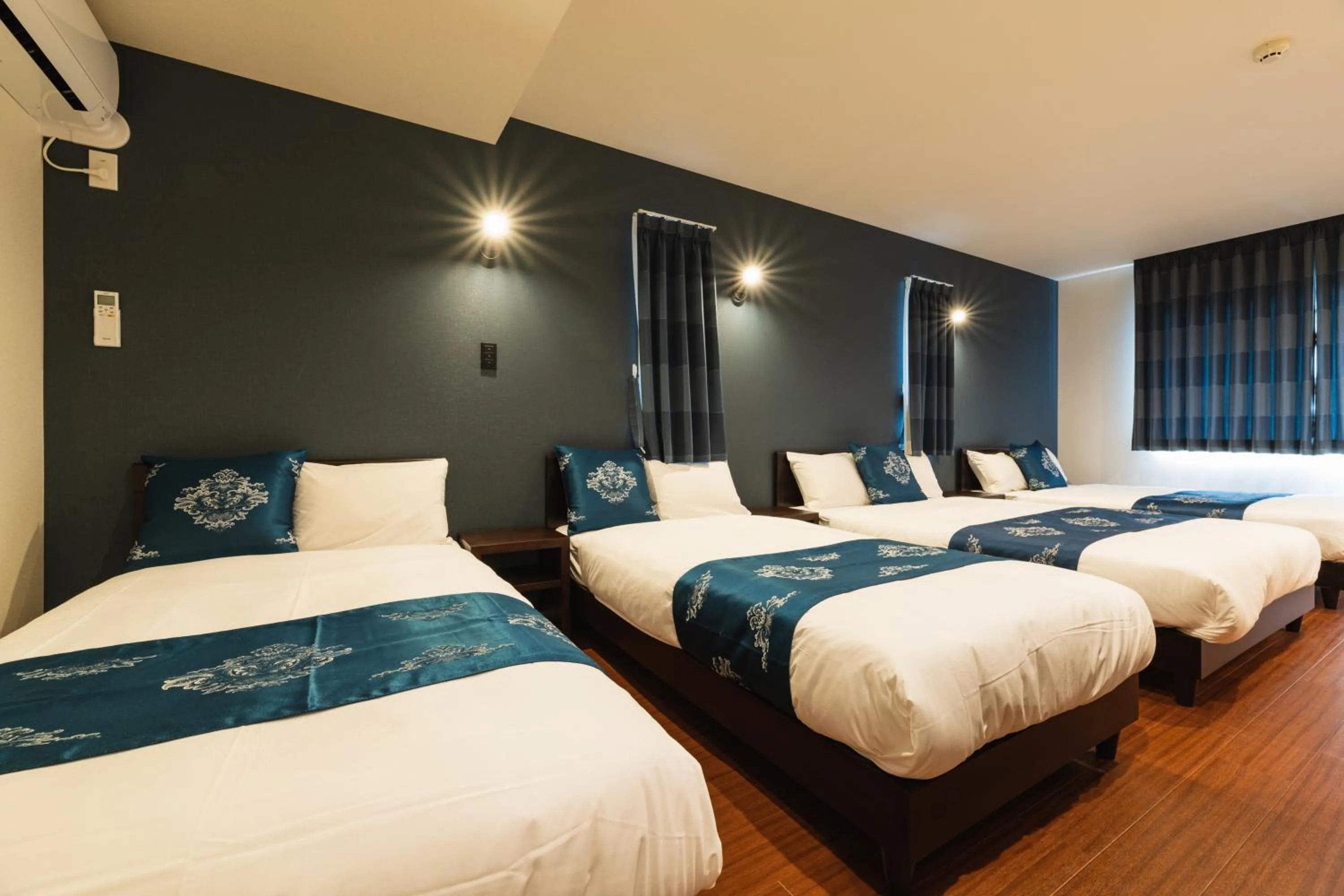 Bed in GRAND BASE Nagasaki City