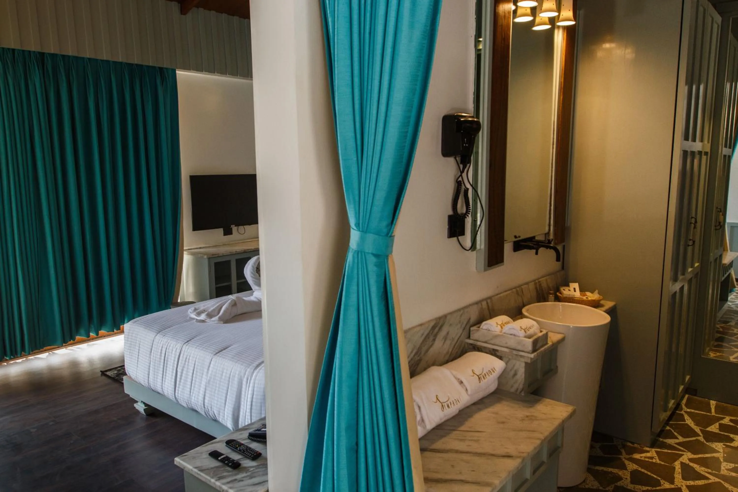 Bathroom, Bed in Symphony Samudra Beachside Jungle Resort And Spa