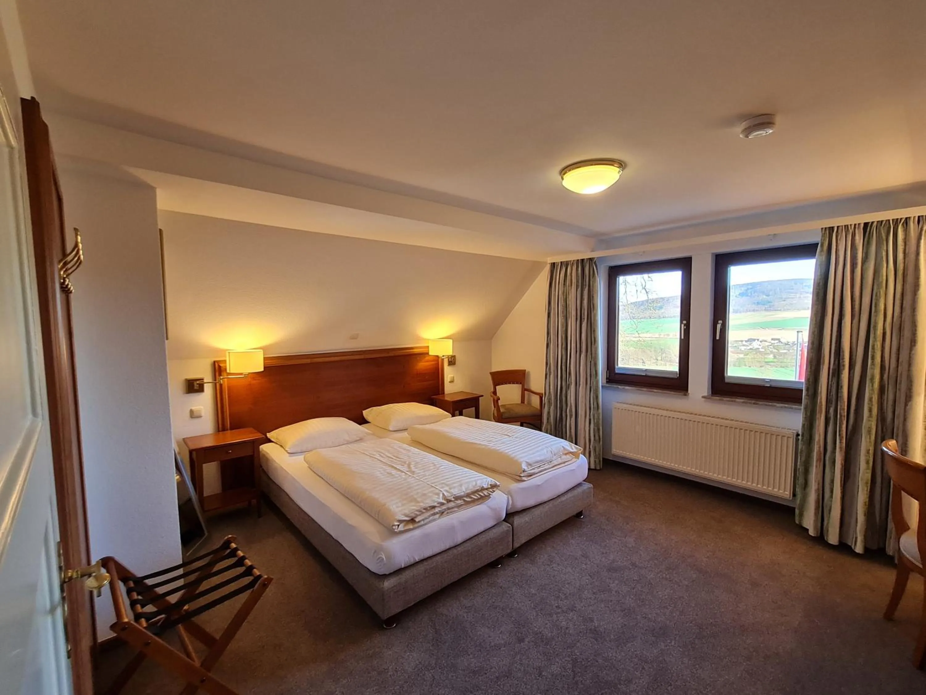 Bed in Hotel Waldquelle - Baumhaushotel Aerzen