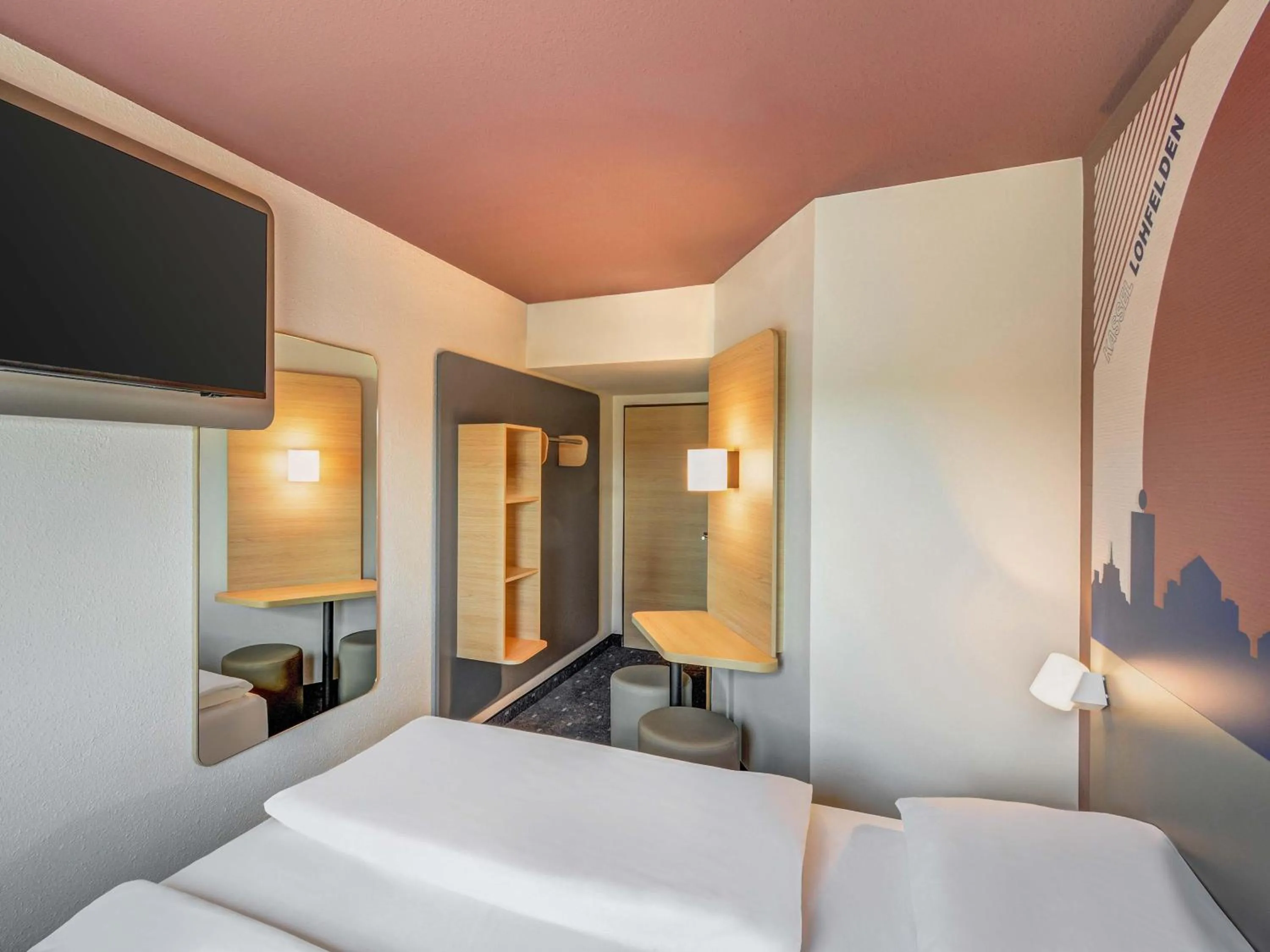 Photo of the whole room, Bed in B&B HOTEL Kassel-Lohfelden