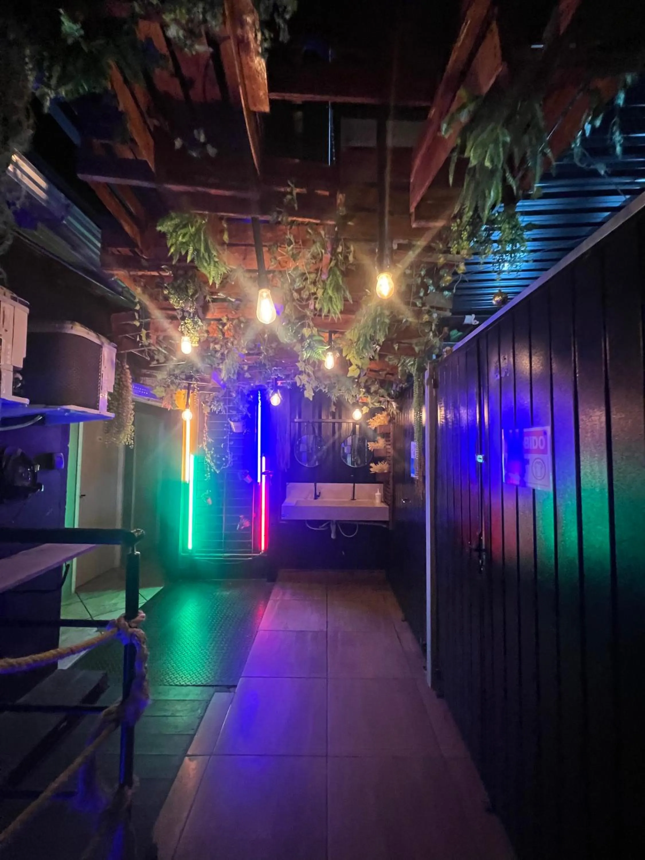 Communal lounge/ TV room in Esquina 8 Suítes Confort & Hostel