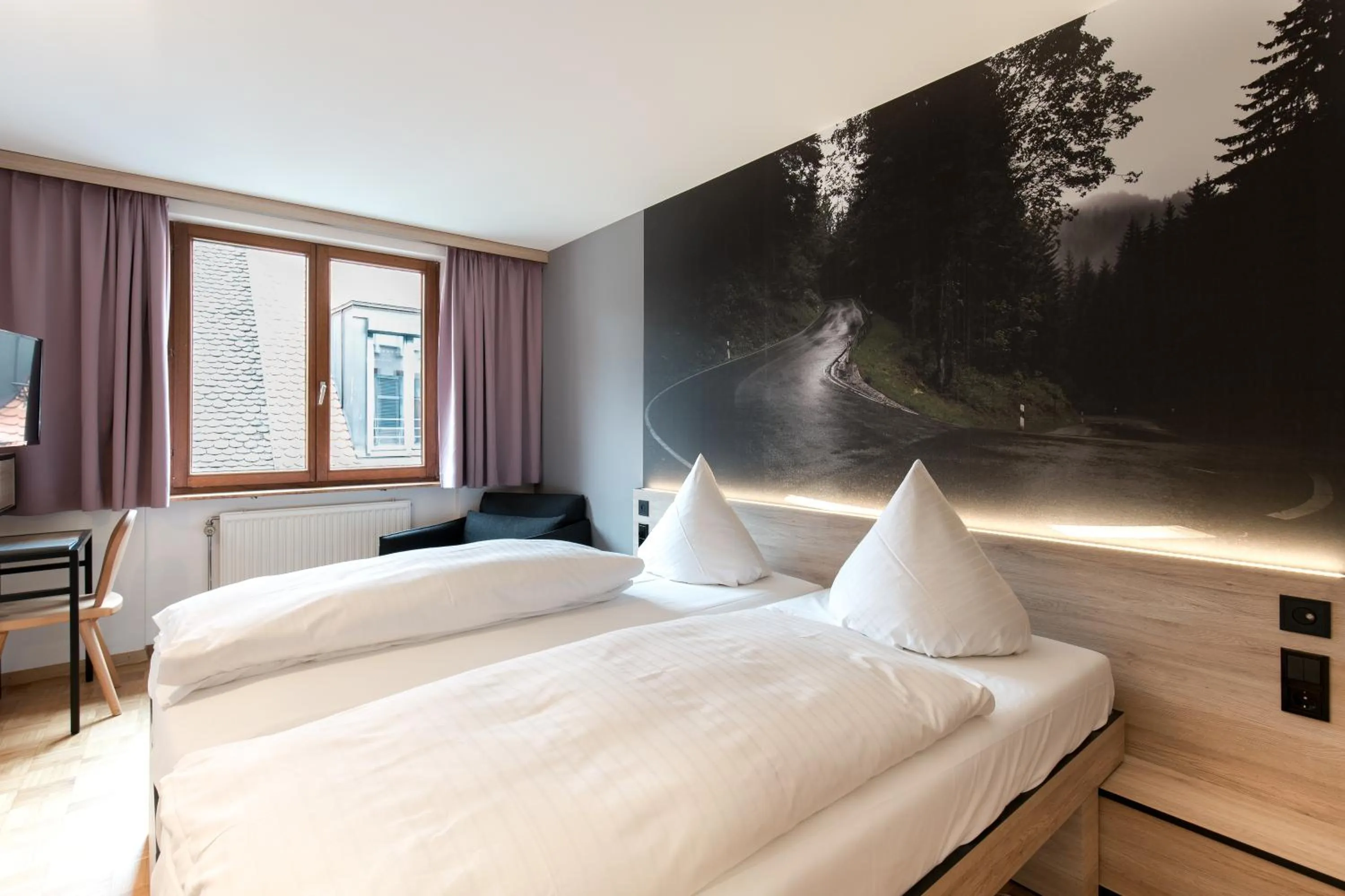 Bed in Hotel Schwarzwälder Hof