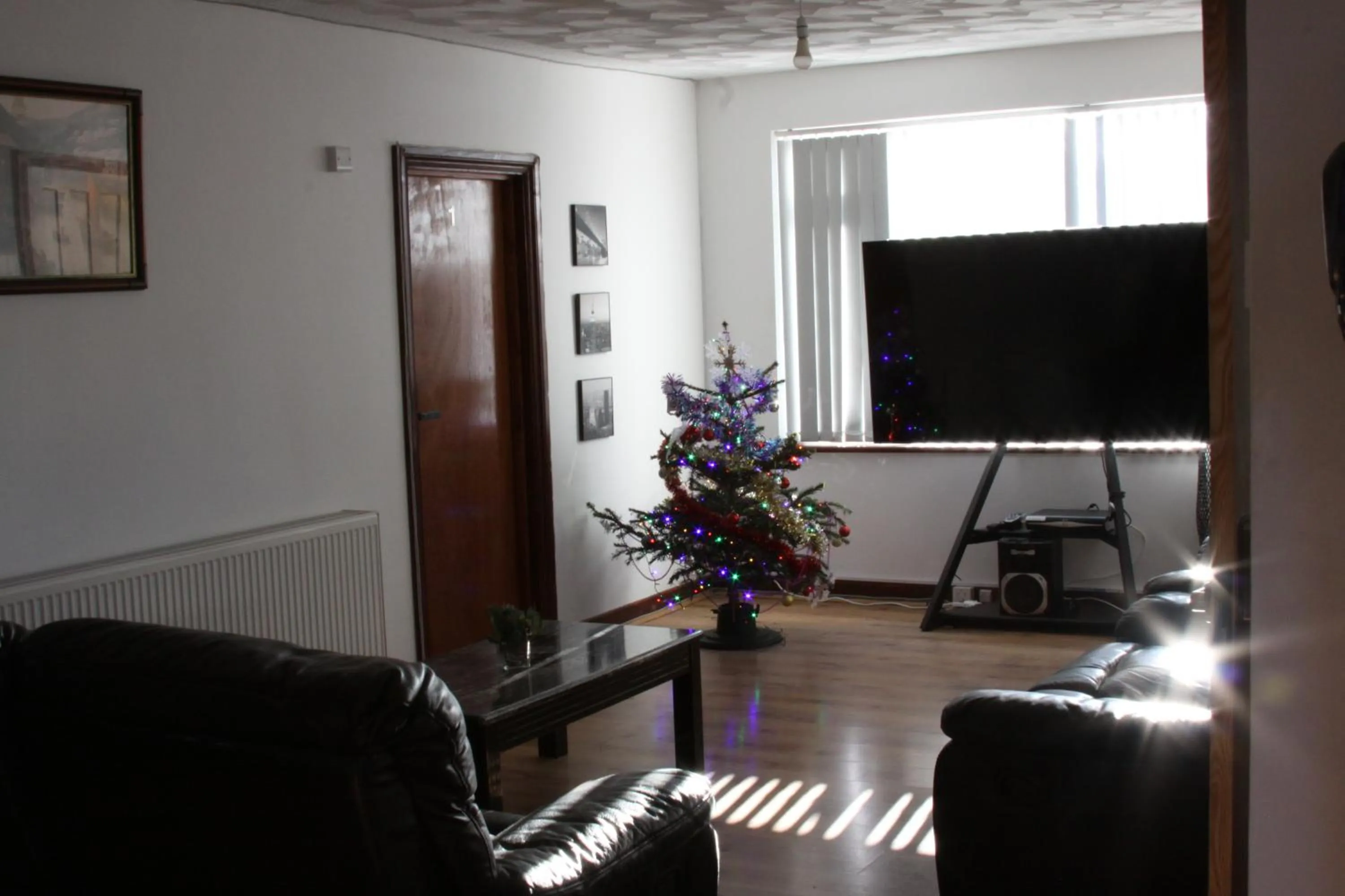 Communal lounge/ TV room in College Street Abode