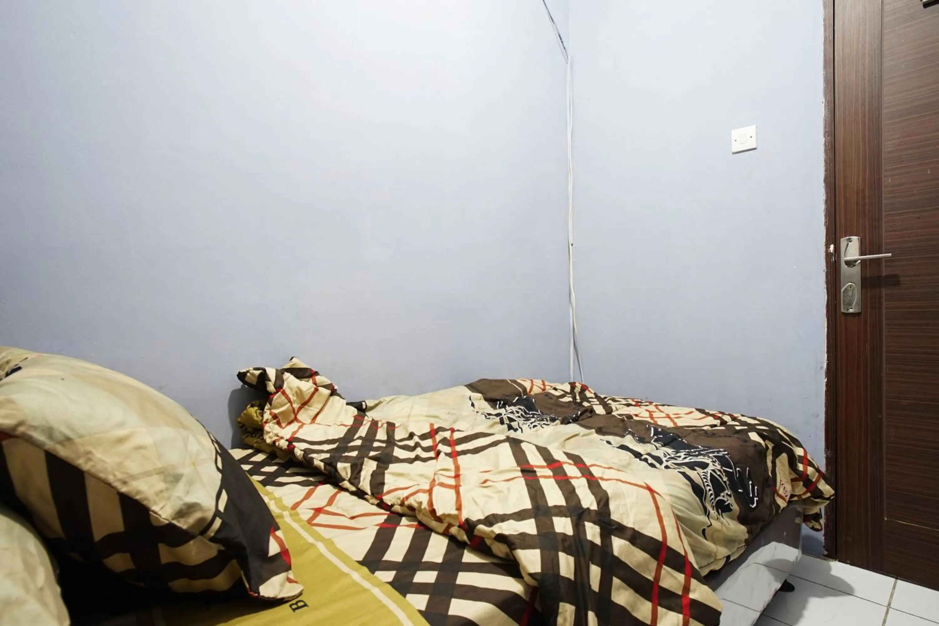 Bed in City Park Apartment by Anita