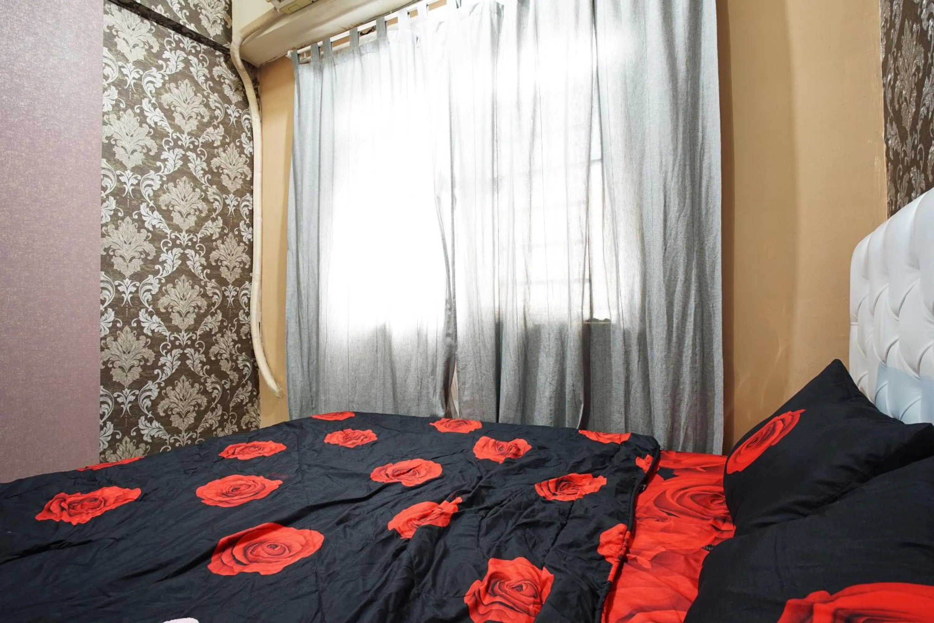 Bed in City Park Apartment by Anita