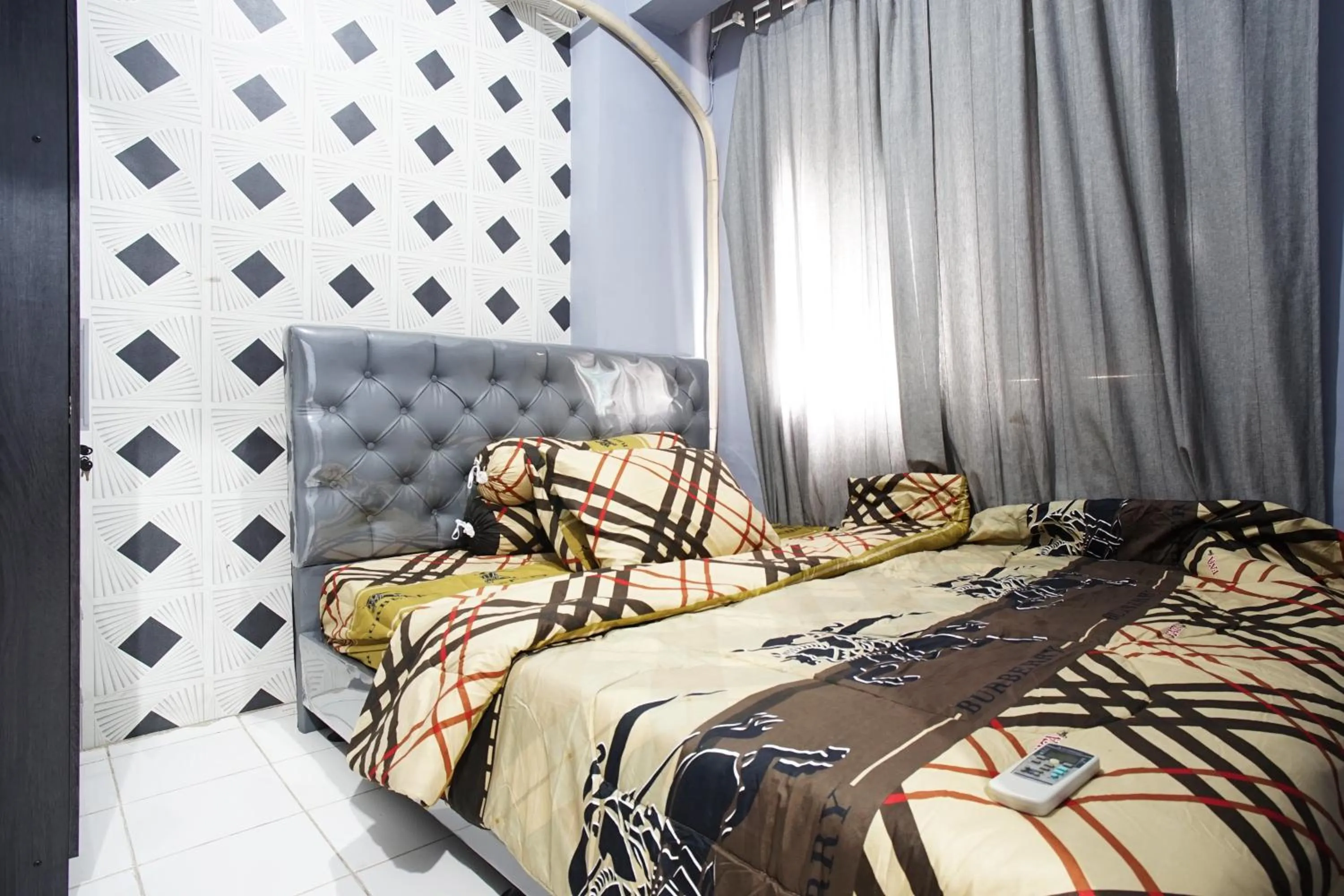 Bed in City Park Apartment by Anita