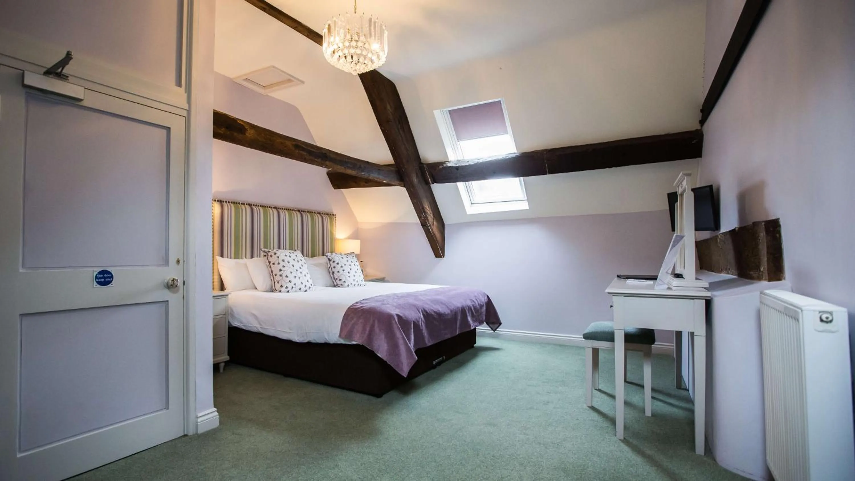 Bed in The Wyndham Hotel