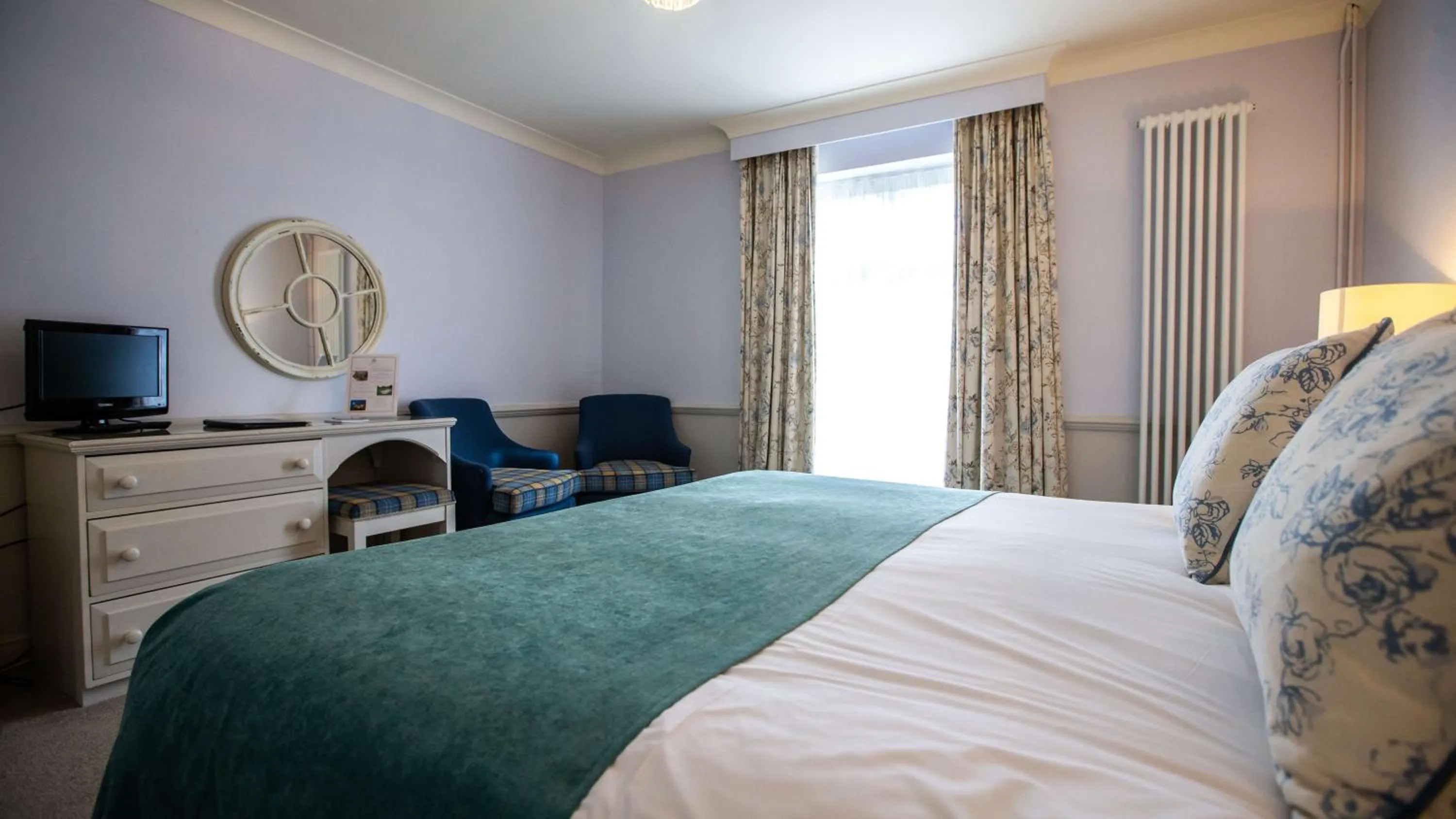 Bed in The Wyndham Hotel