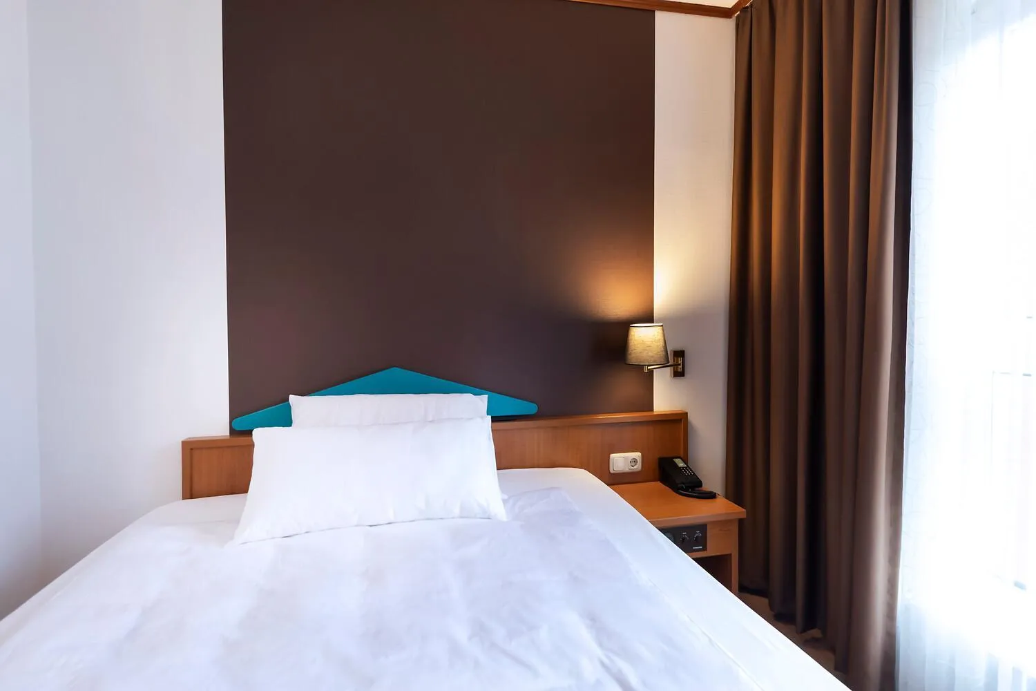 Bed in ACHAT Hotel Frankfurt Maintal