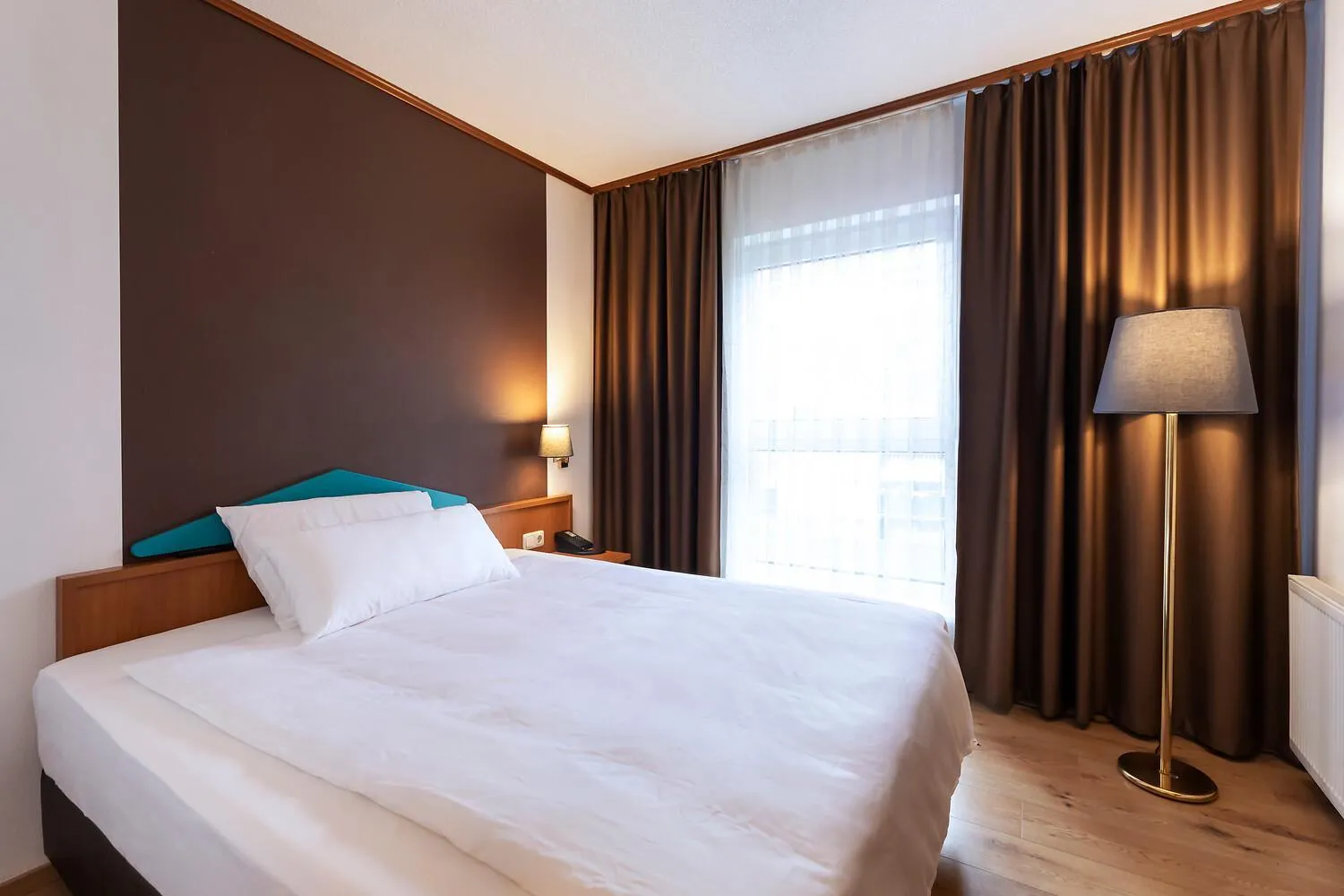 Bed in ACHAT Hotel Frankfurt Maintal