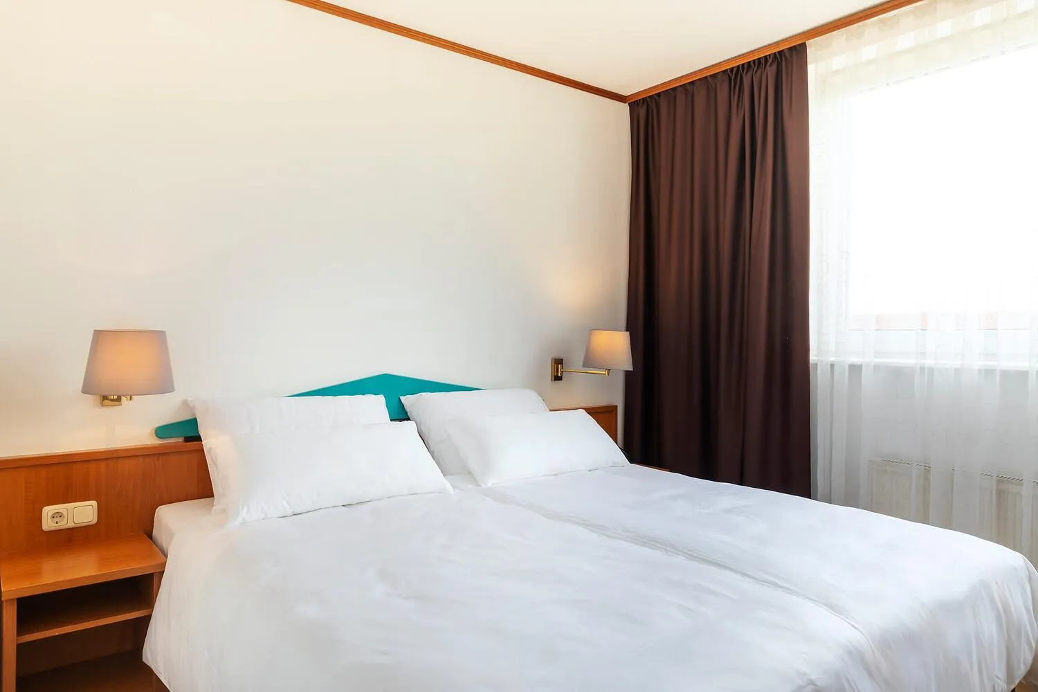 Bed in ACHAT Hotel Frankfurt Maintal