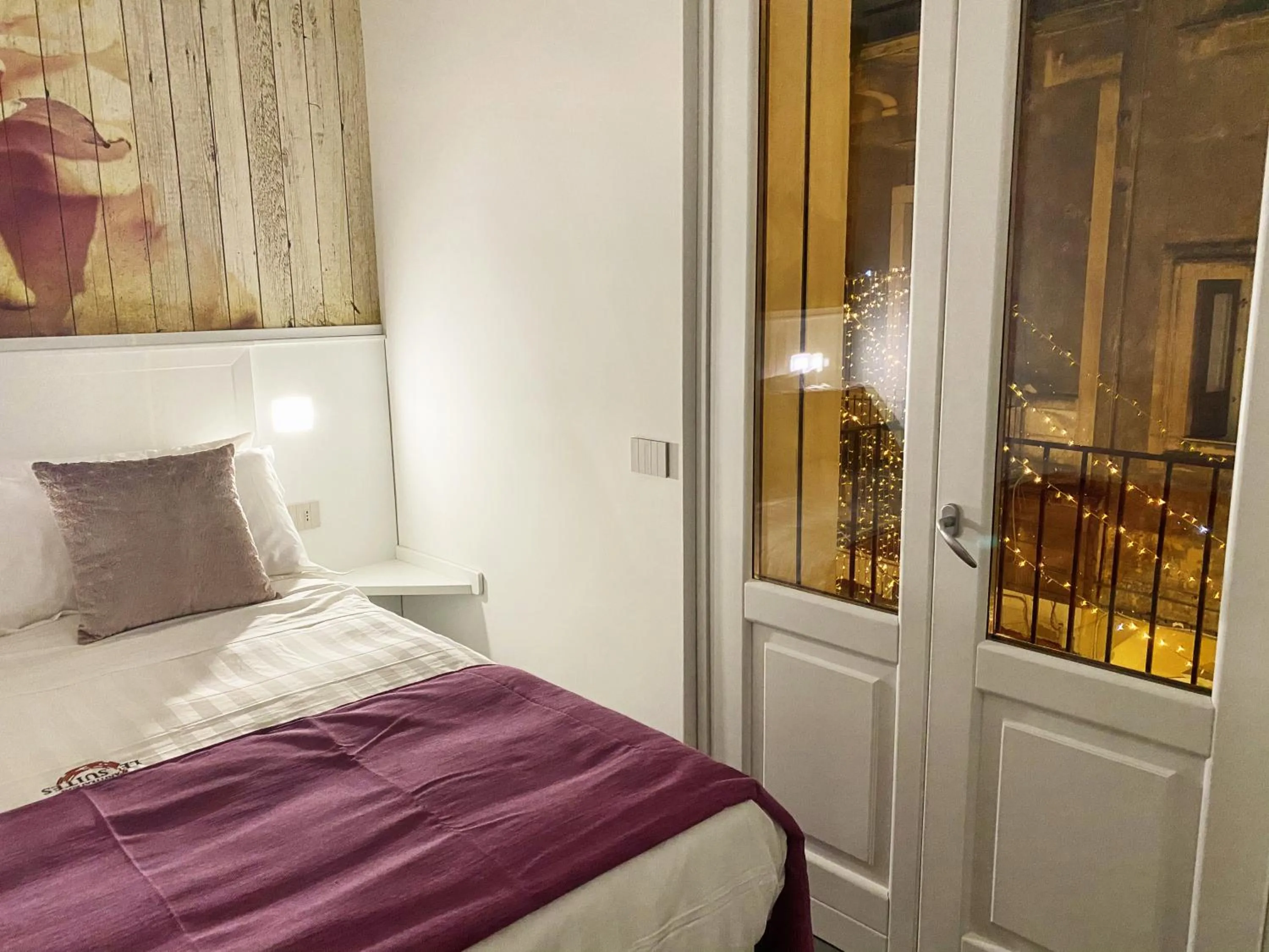 Bed in ANFITEATRO LE SUITES