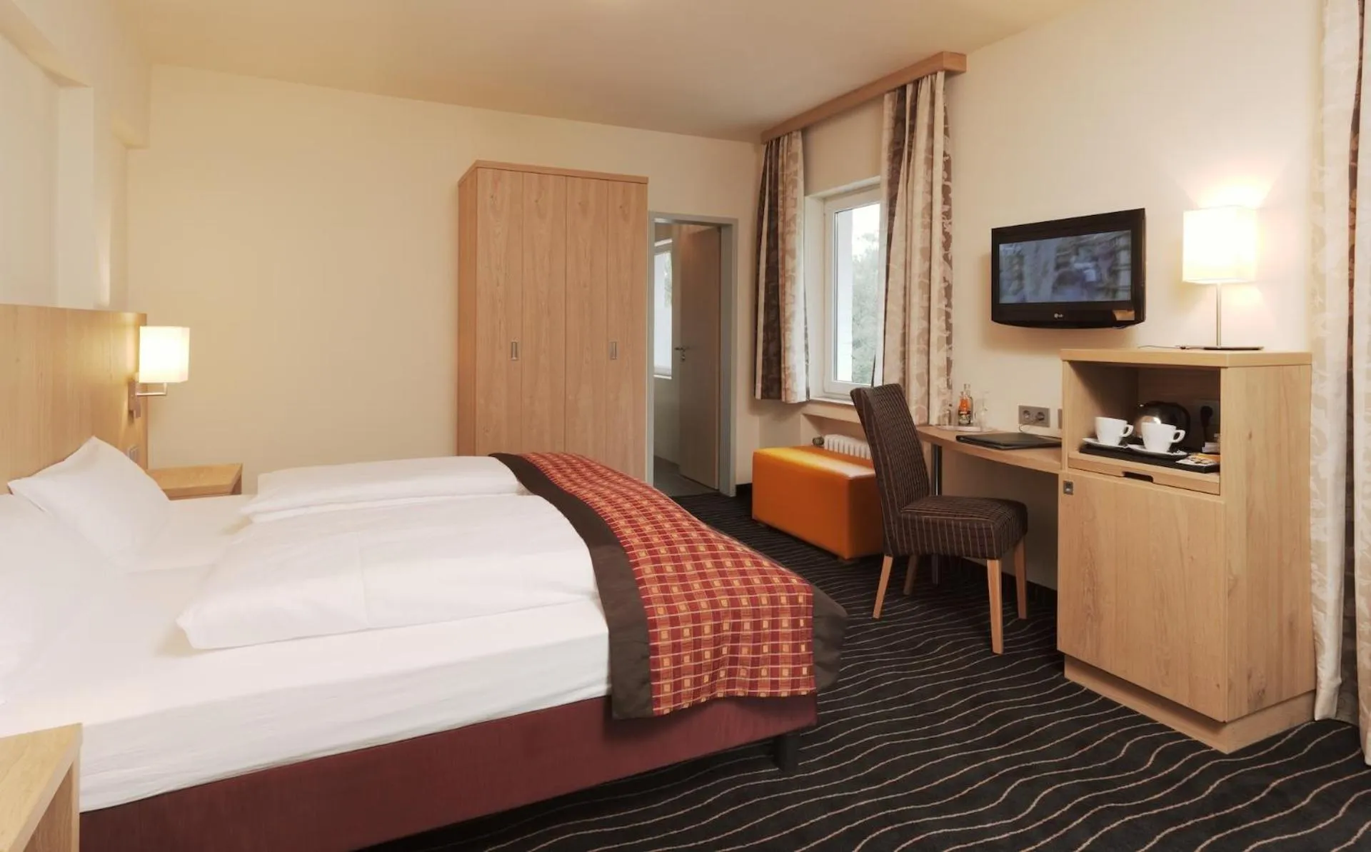 Photo of the whole room, Bed in Berghotel Hohe Mark