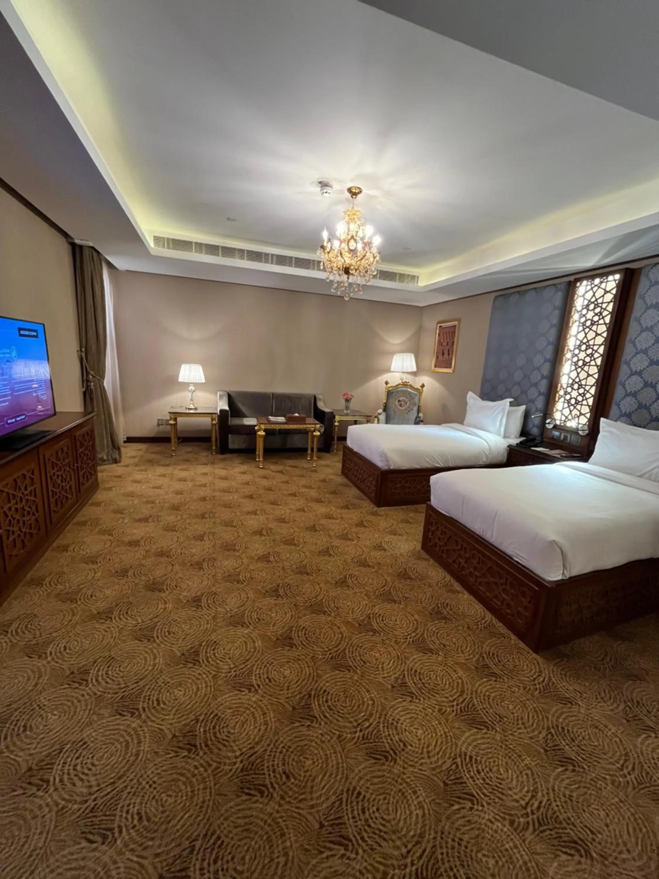 Communal lounge/ TV room, Bed in Al Rahden Hotel