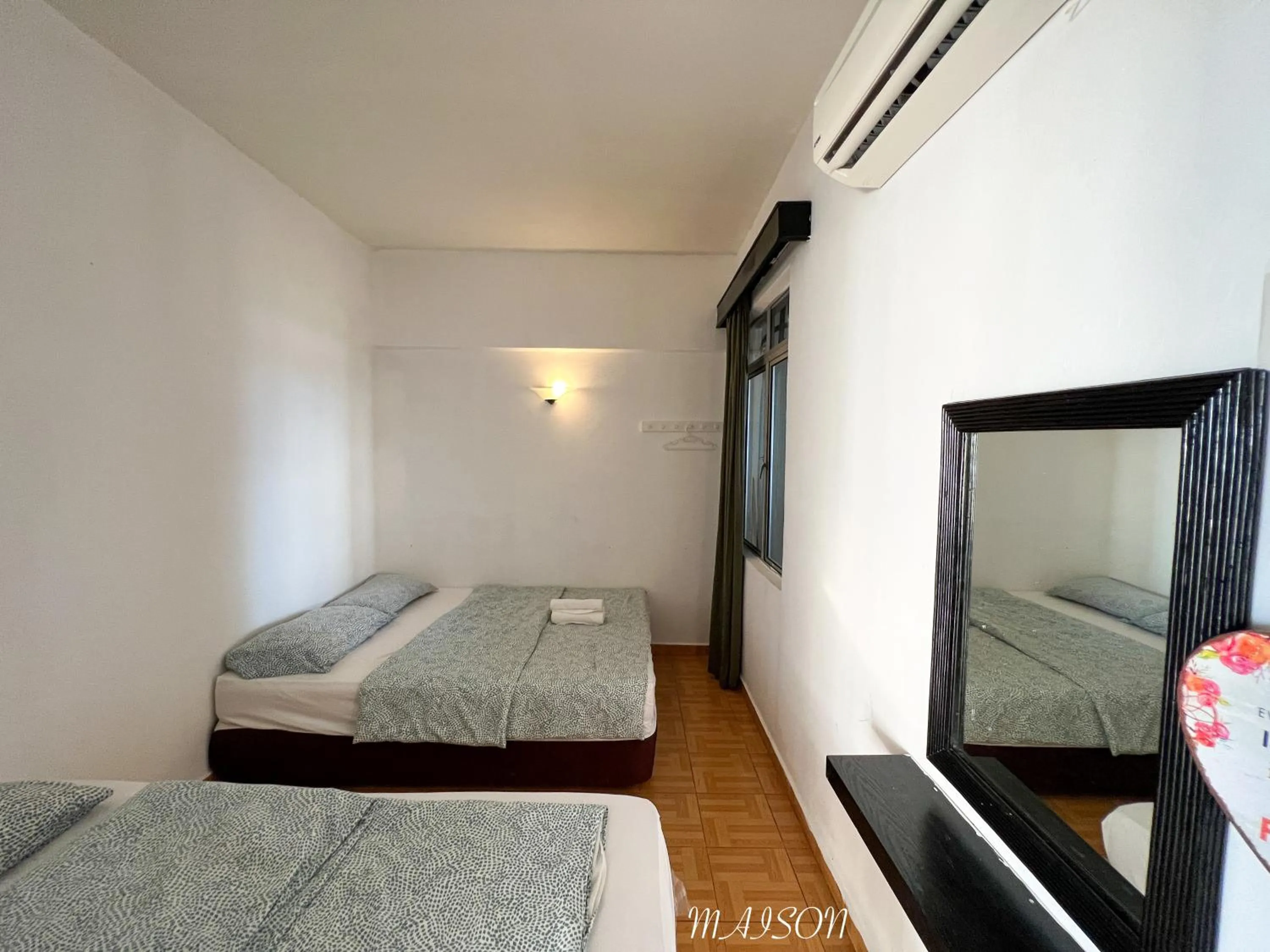 Bed in Maison Seaview Suites Port Dickson