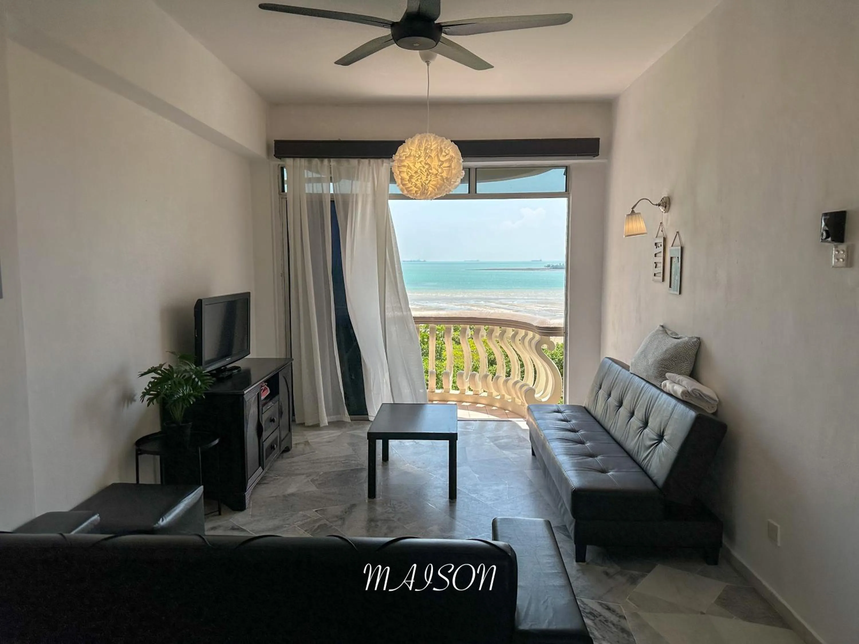 Communal lounge/ TV room in Maison Seaview Suites Port Dickson