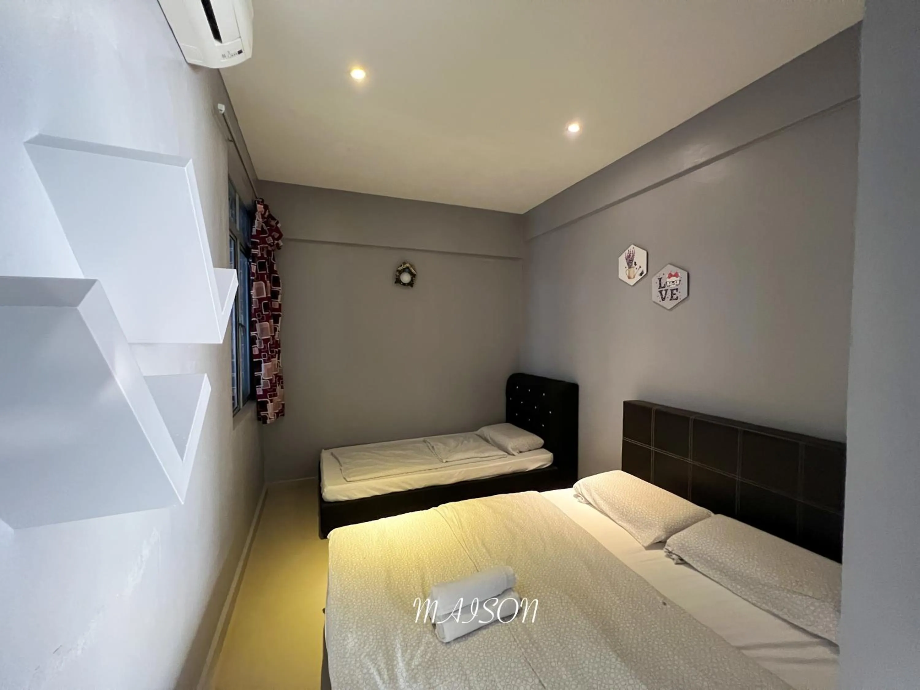 Bed in Maison Seaview Suites Port Dickson