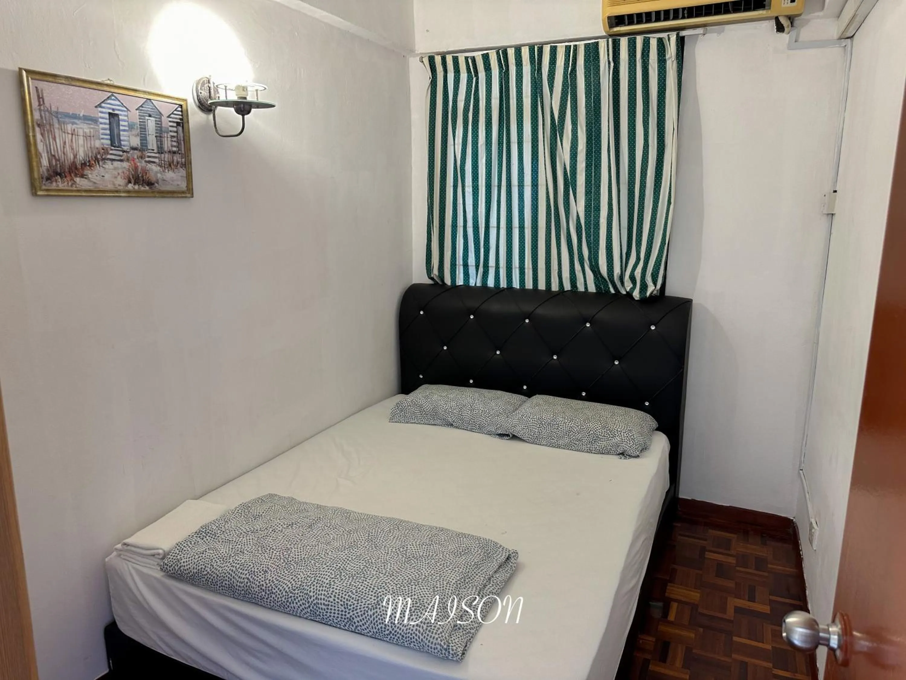 Bed in Maison Seaview Suites Port Dickson