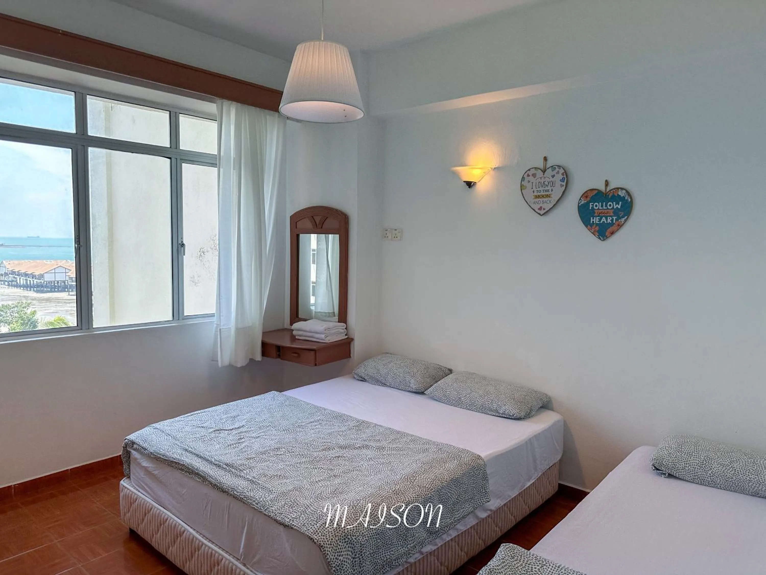 Bed in Maison Seaview Suites Port Dickson