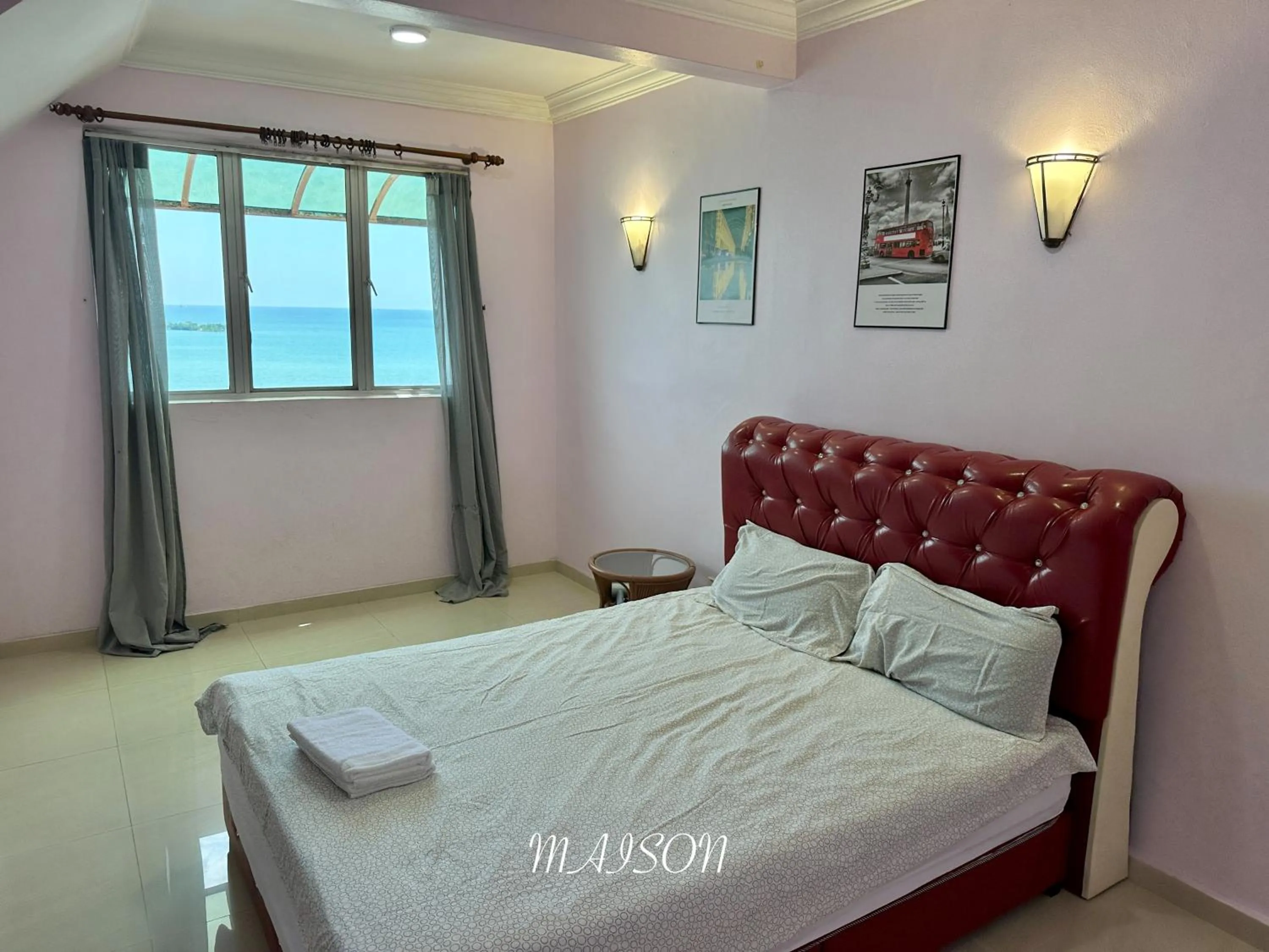 Bed in Maison Seaview Suites Port Dickson