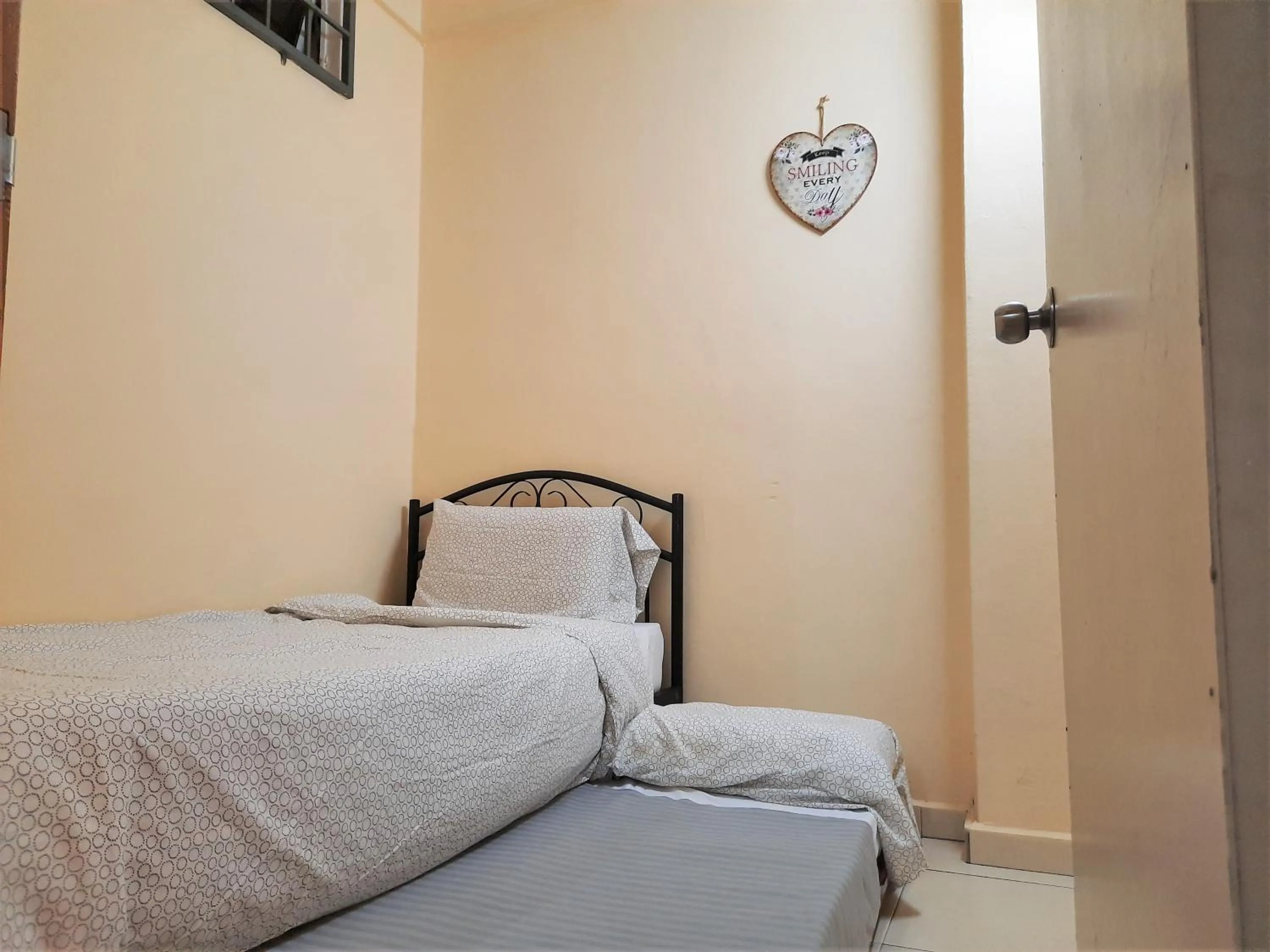 Bed in Maison Seaview Suites Port Dickson