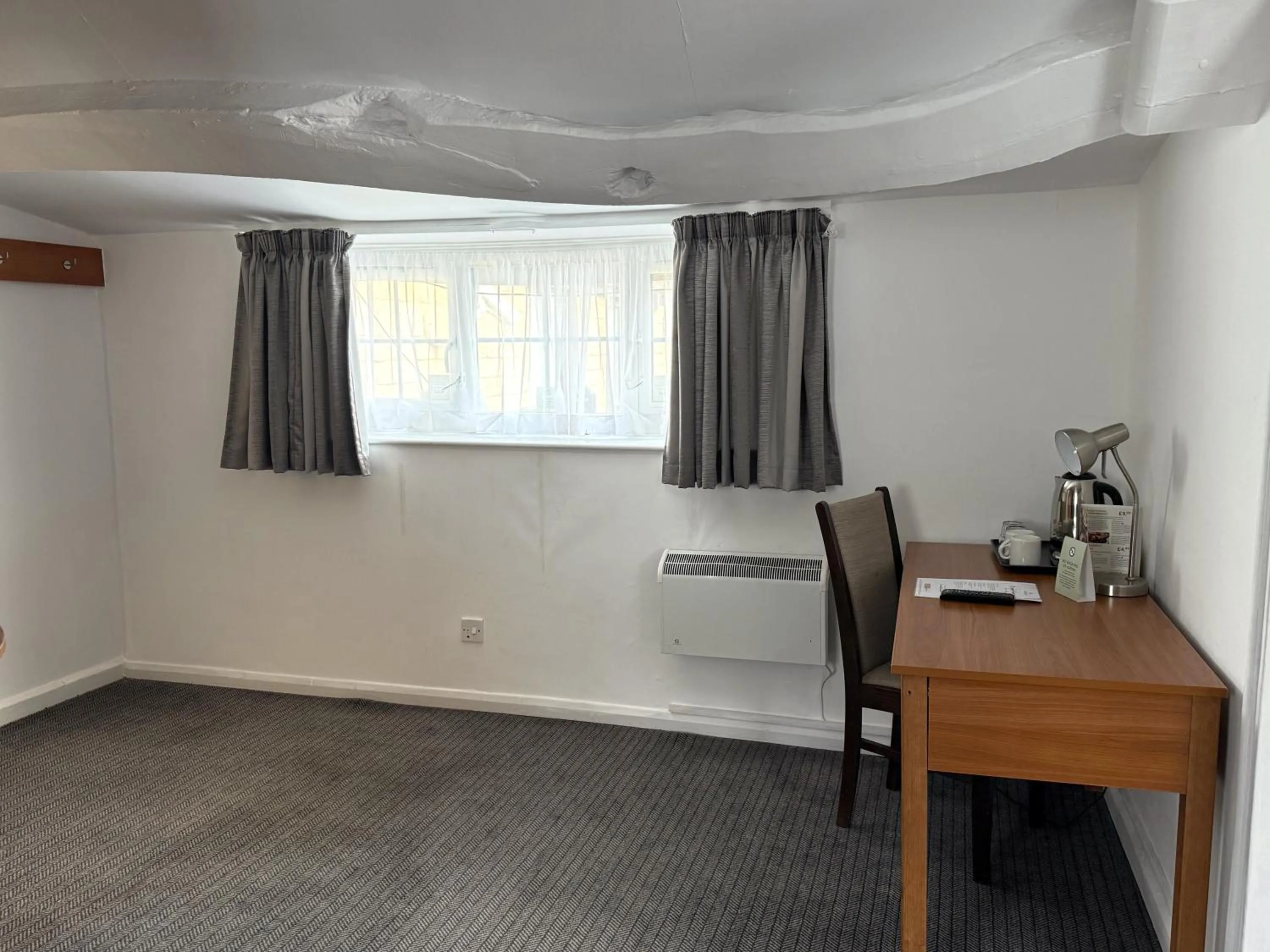 Seating area in The Bowman by Greene King Inns