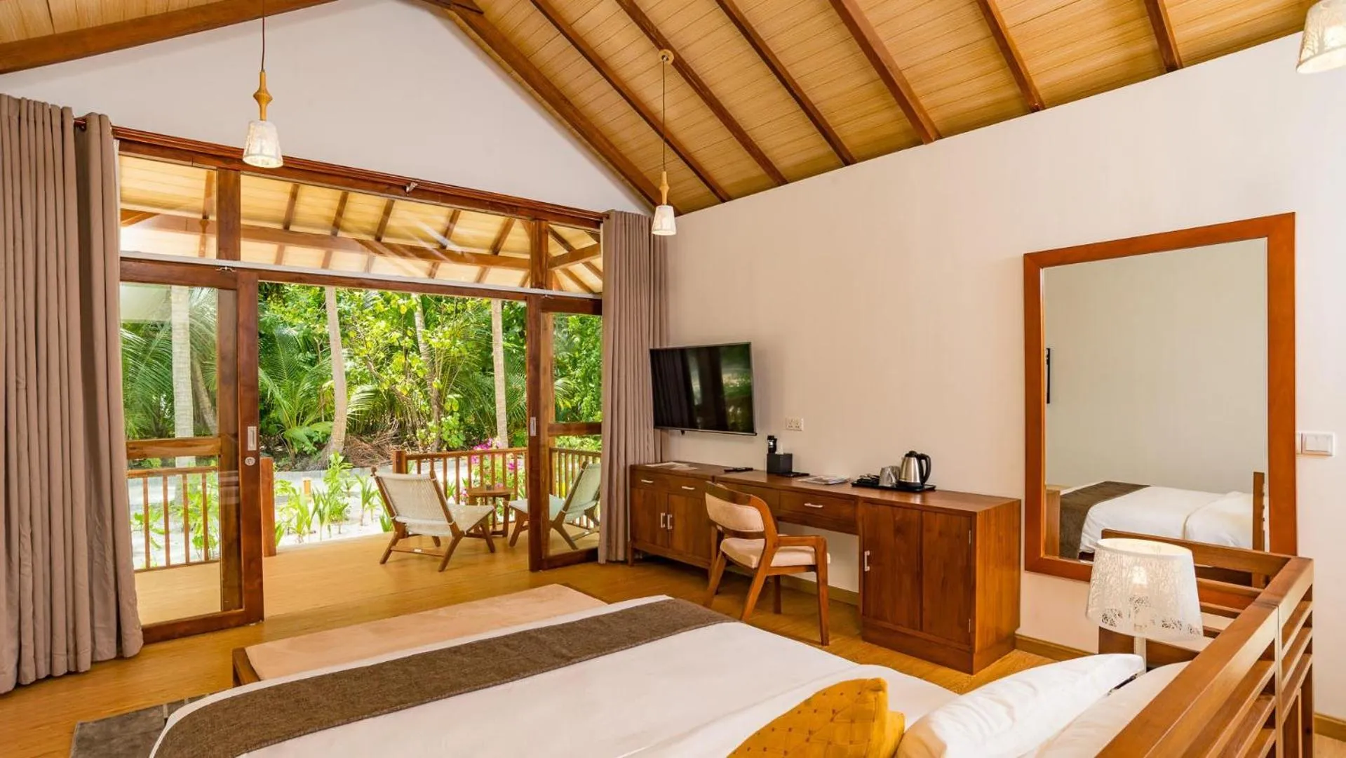 Seating area, Bed in Fiyavalhu Resort Maldives