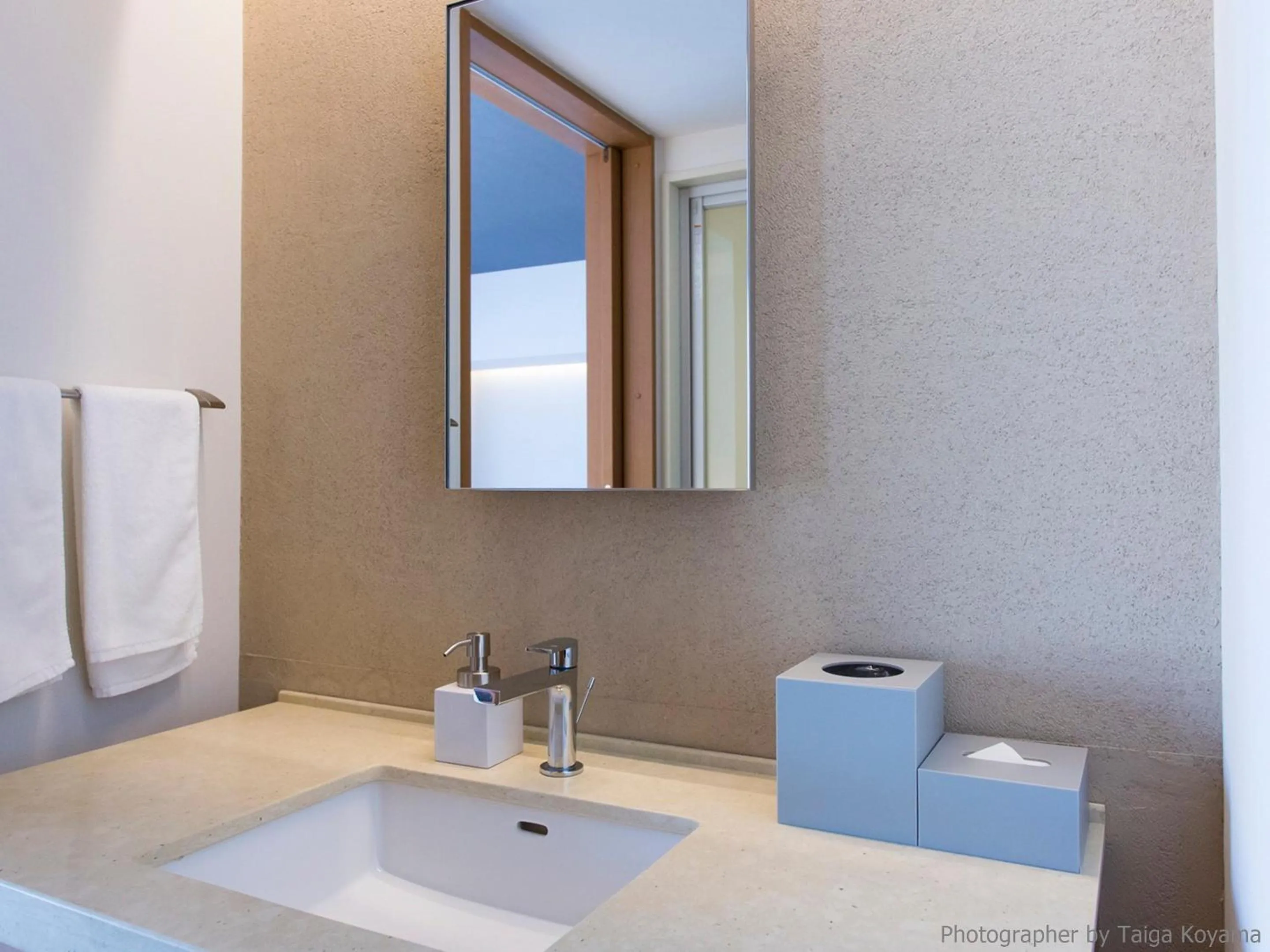 Text overlay in HOTEL STRATA NAHA