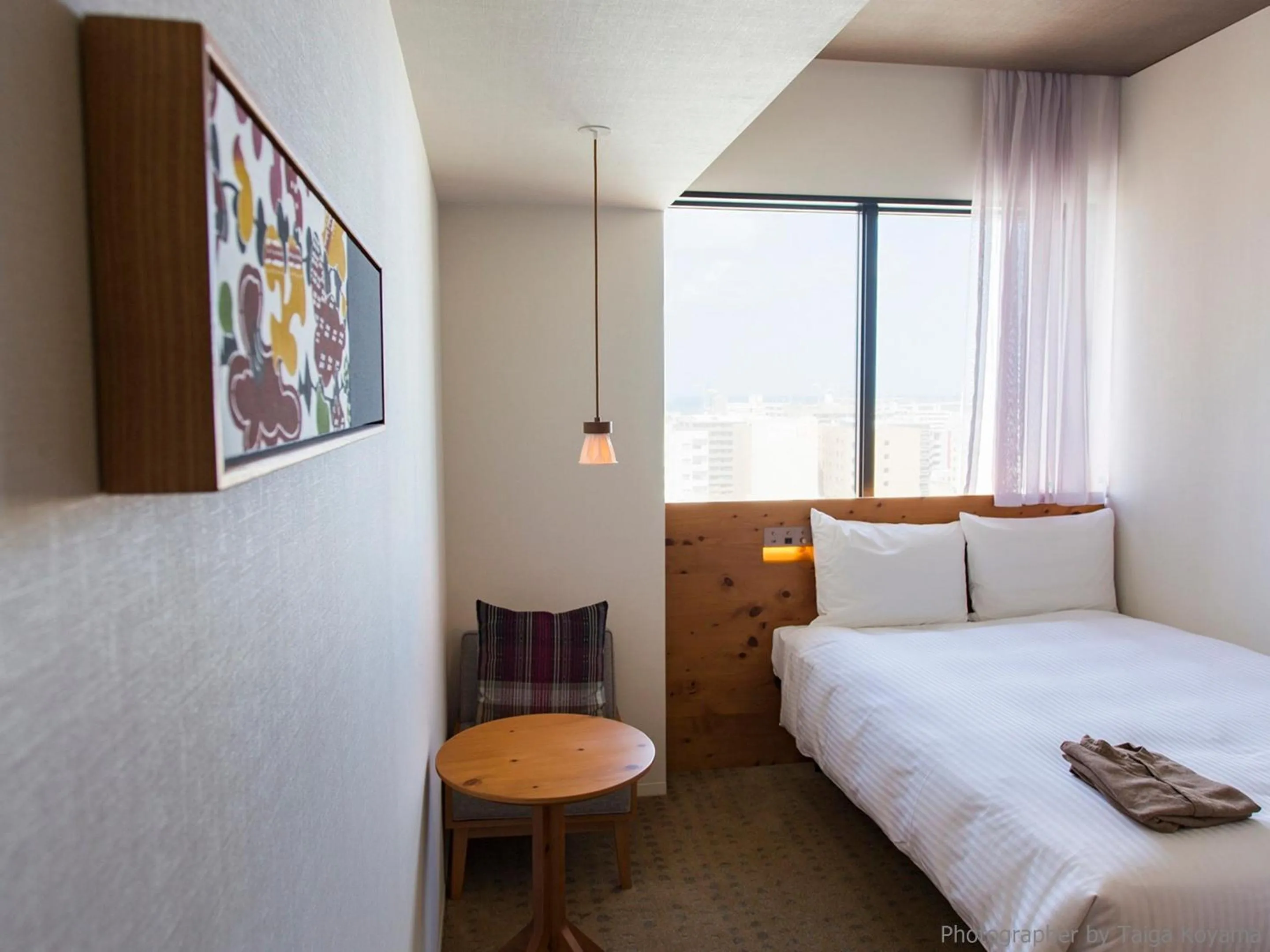 Text overlay, Bed in HOTEL STRATA NAHA