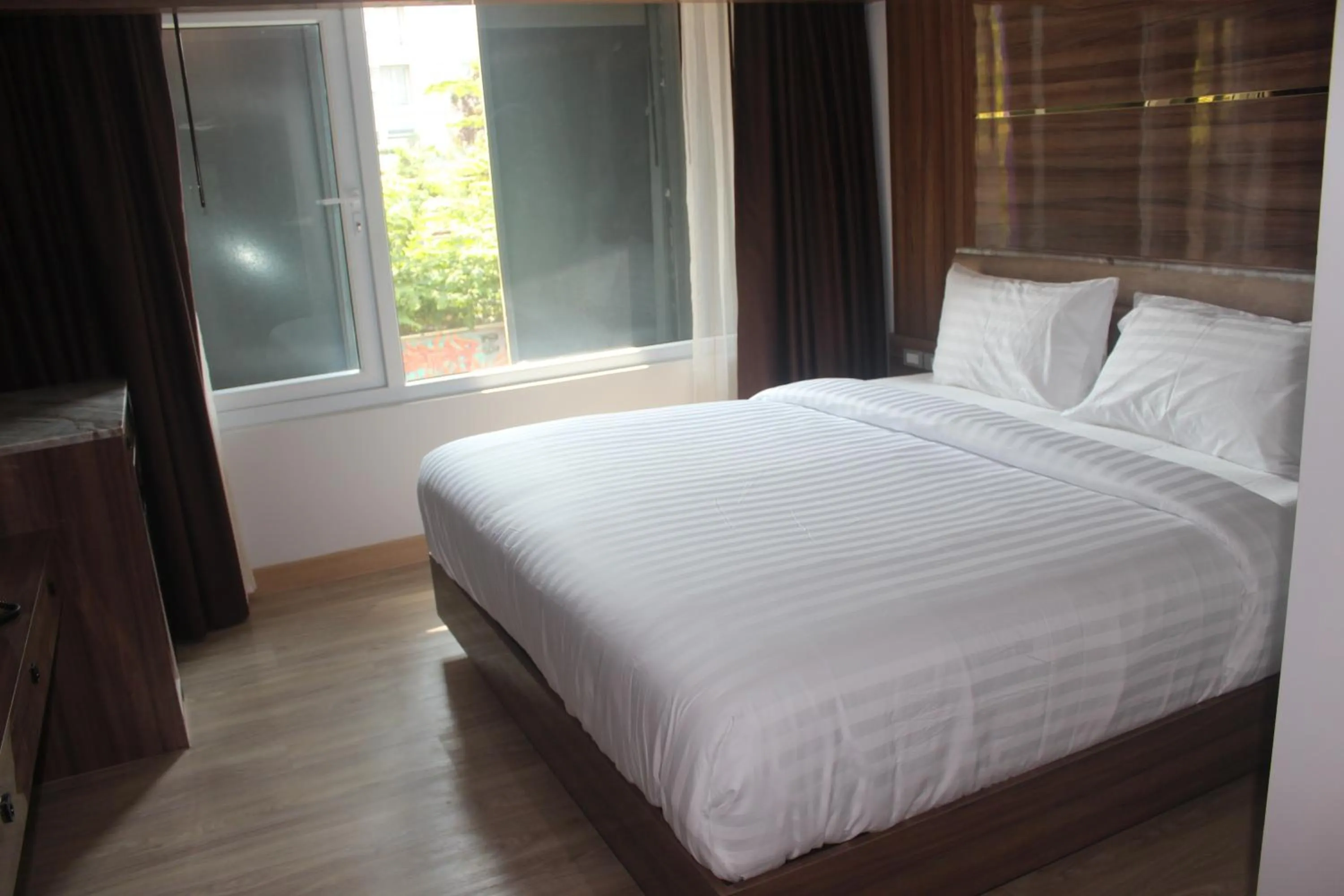 Bed in H-District Boutique Poshotel