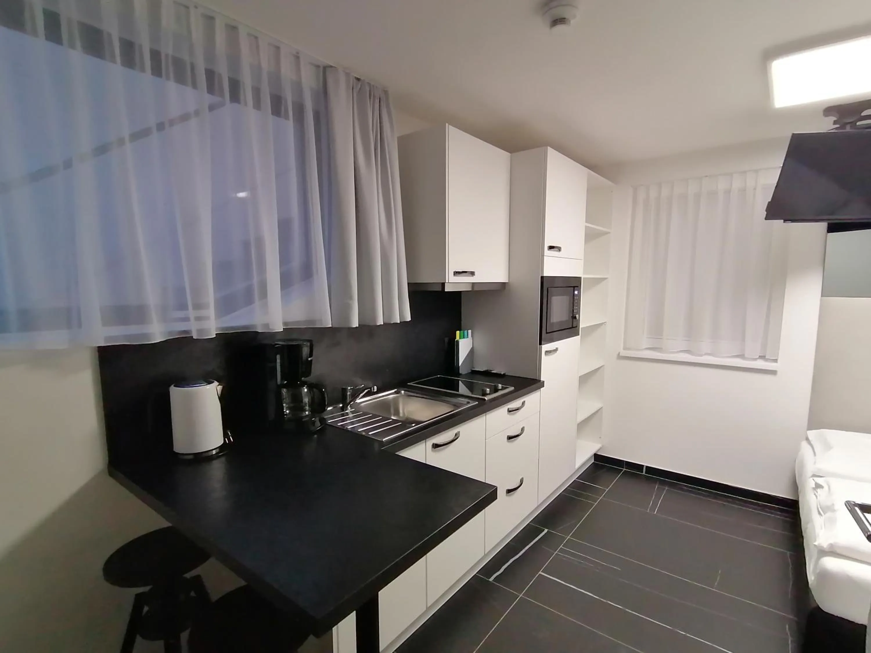 Kitchen or kitchenette in The Place Boutique & Design Hotel Flachau