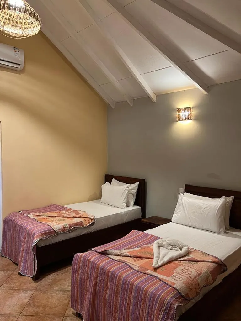 Bed in Tropic Garden Hotel