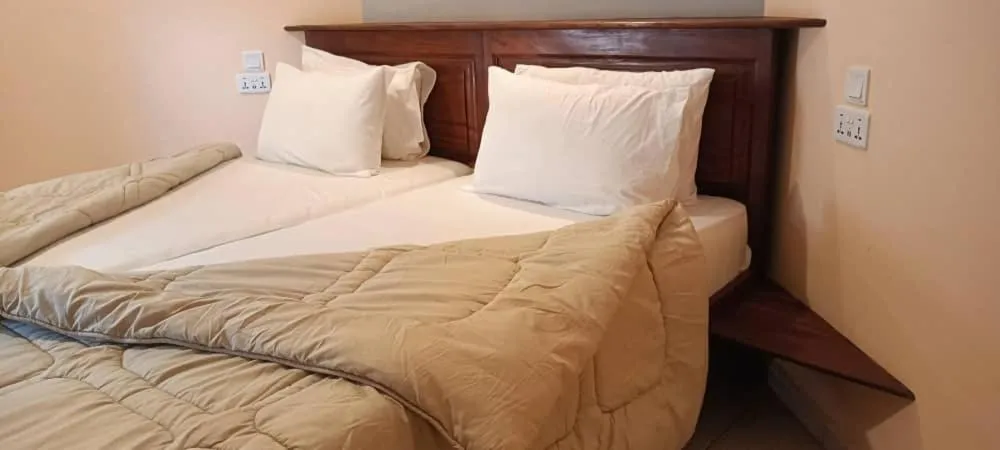 Bed in Tropic Garden Hotel