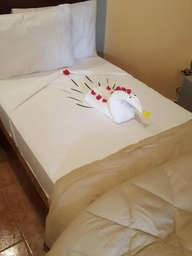 Bed in Tropic Garden Hotel