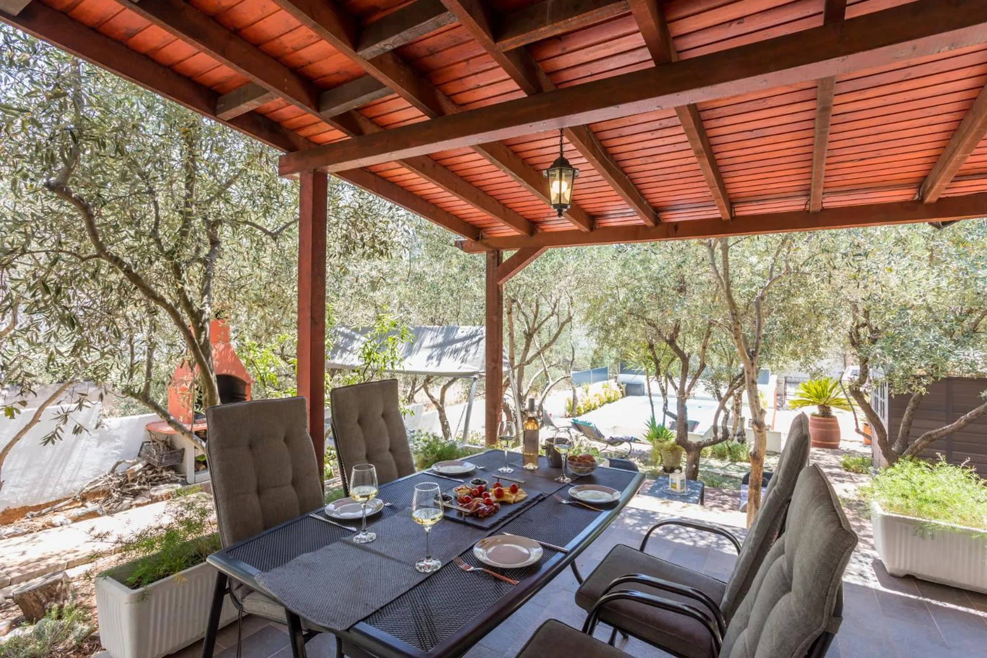 House with big walled oliva garden