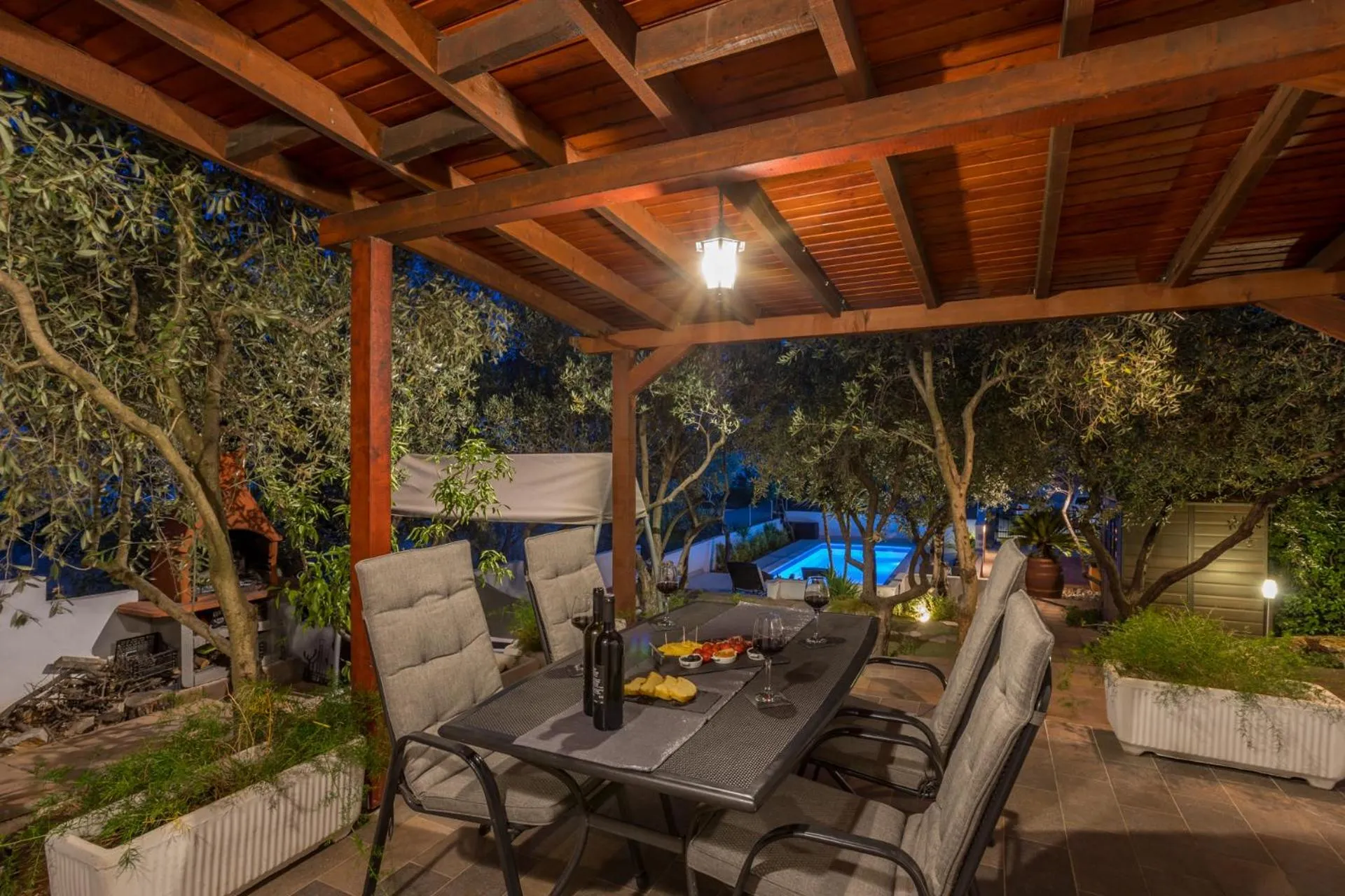 House with big walled oliva garden