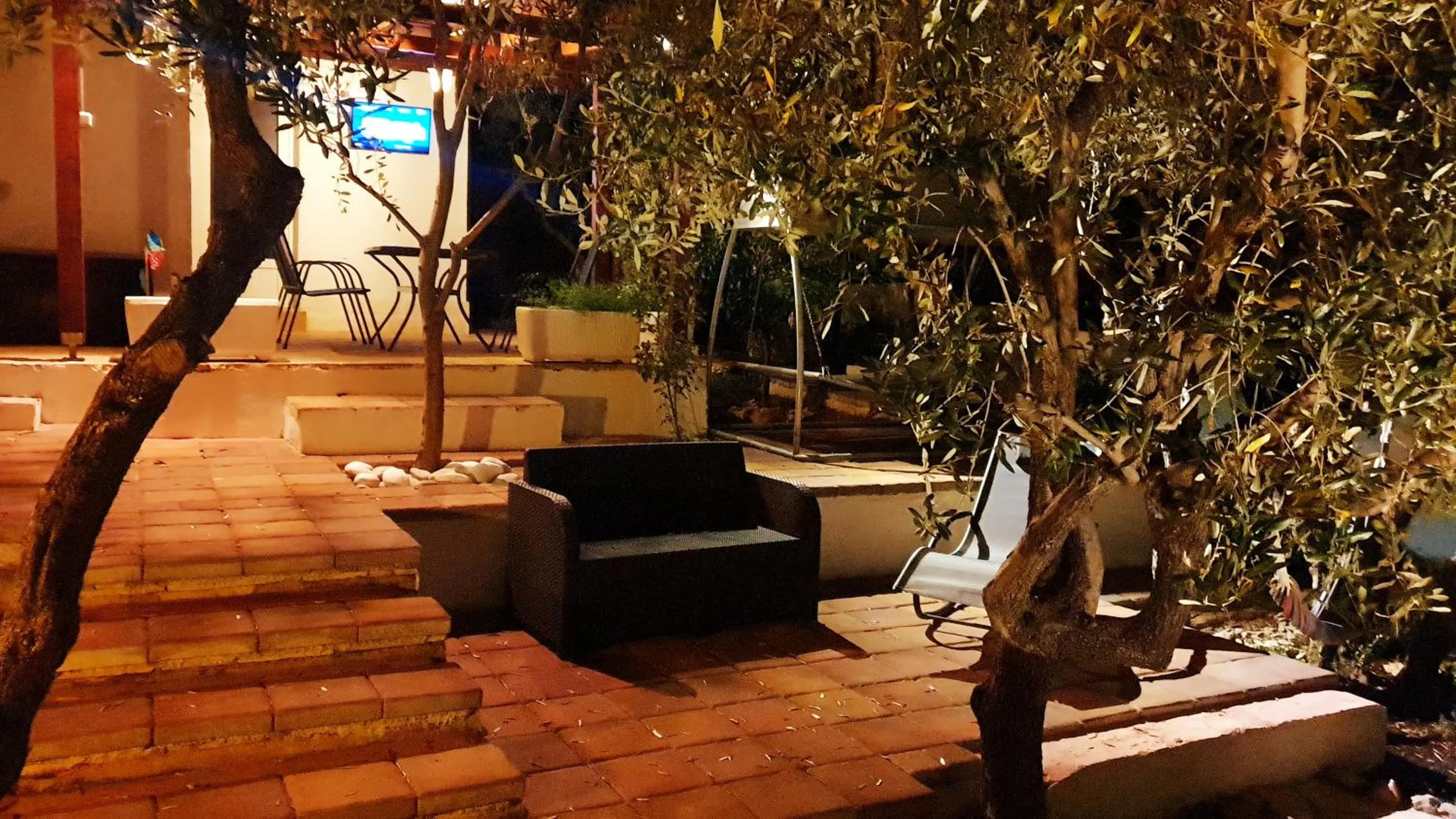 furniture in House with big walled oliva garden