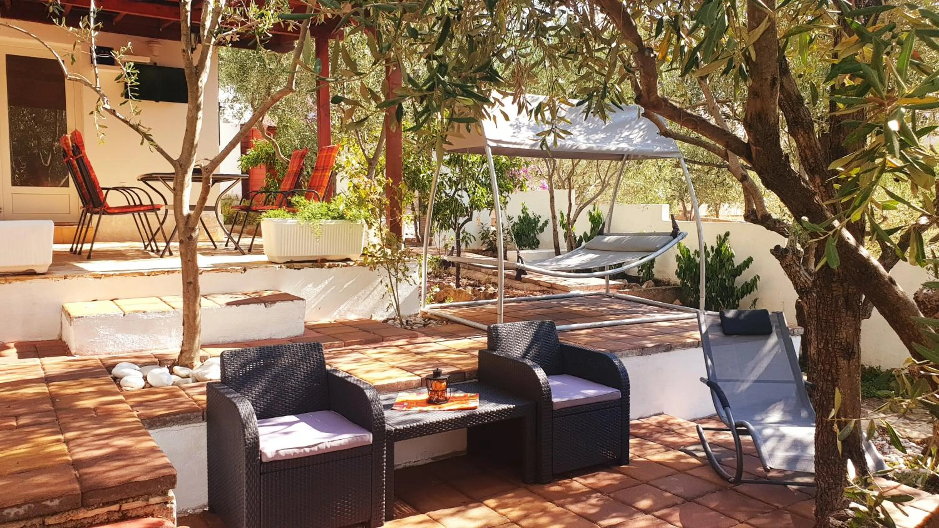 furniture in House with big walled oliva garden