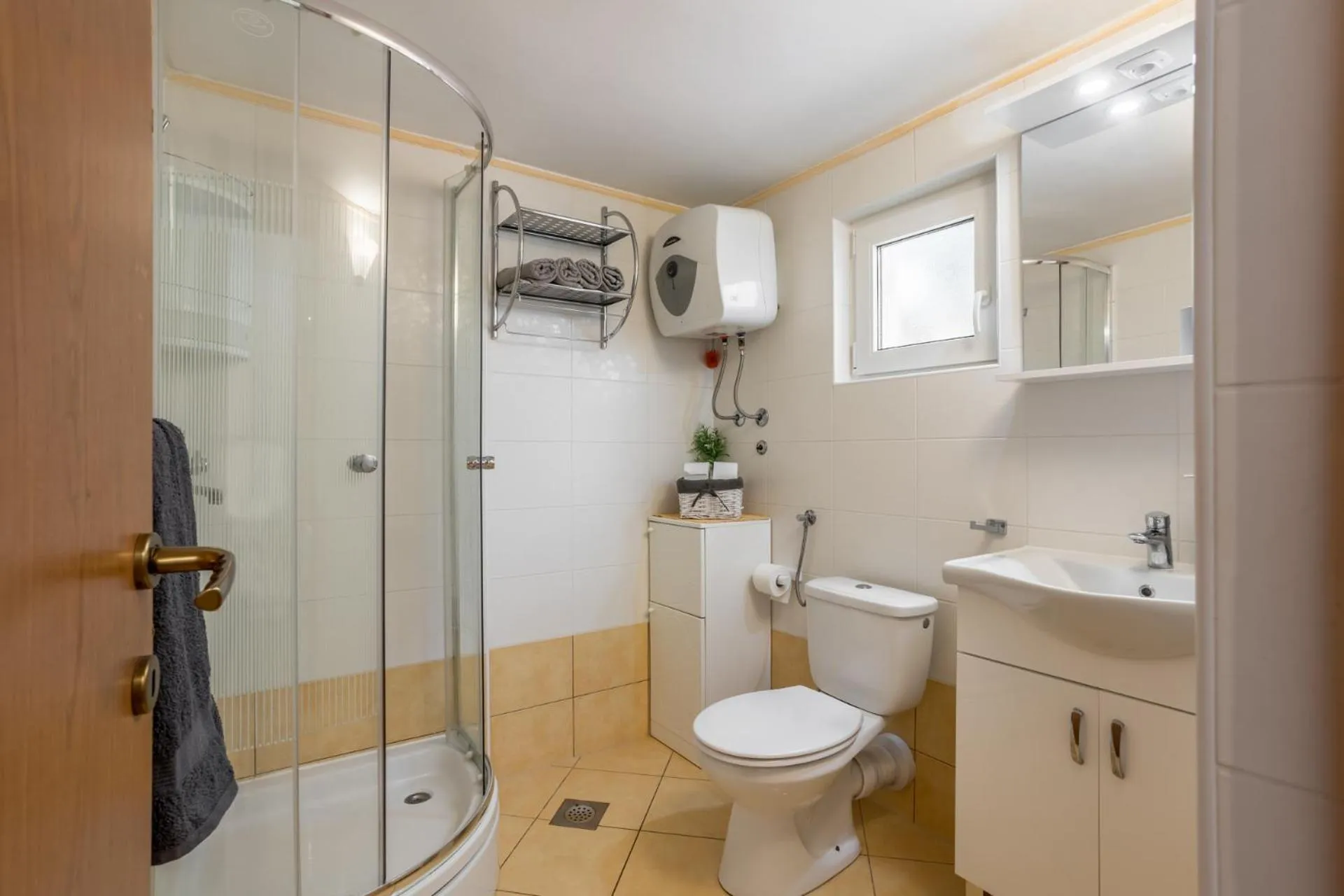 Bathroom in House with big walled oliva garden