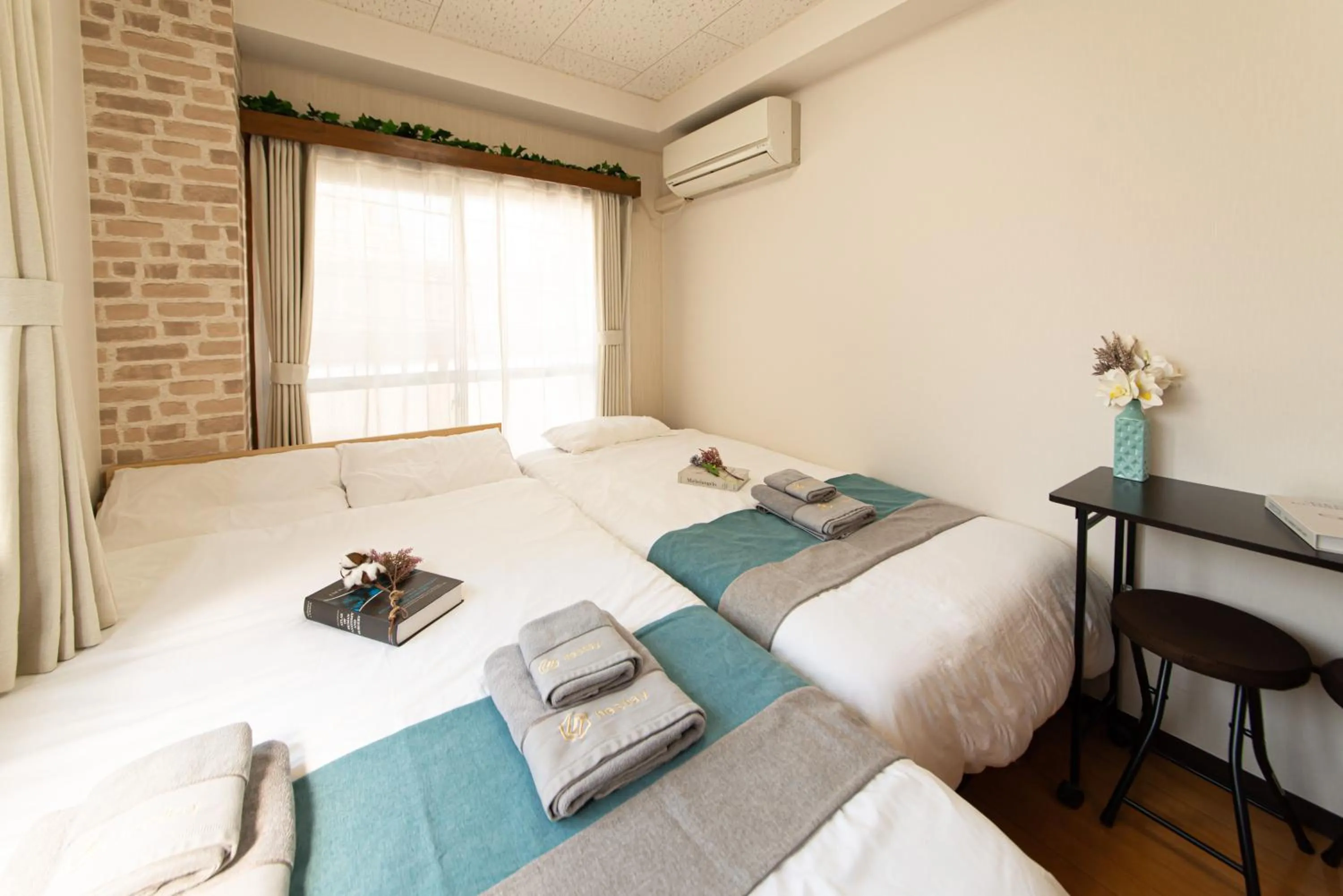 Bed in nestay suite tokyo tabata