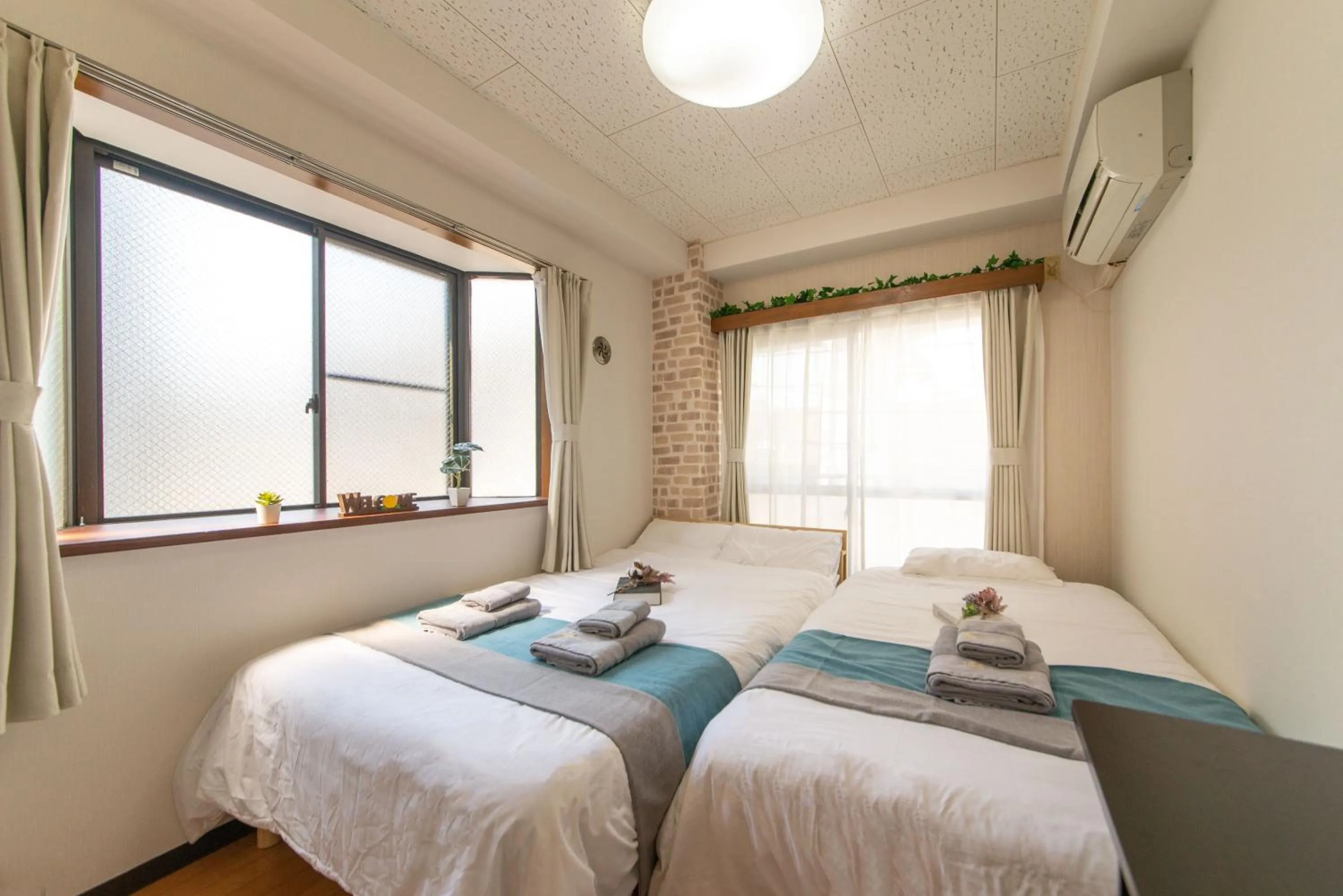 Bed in nestay suite tokyo tabata