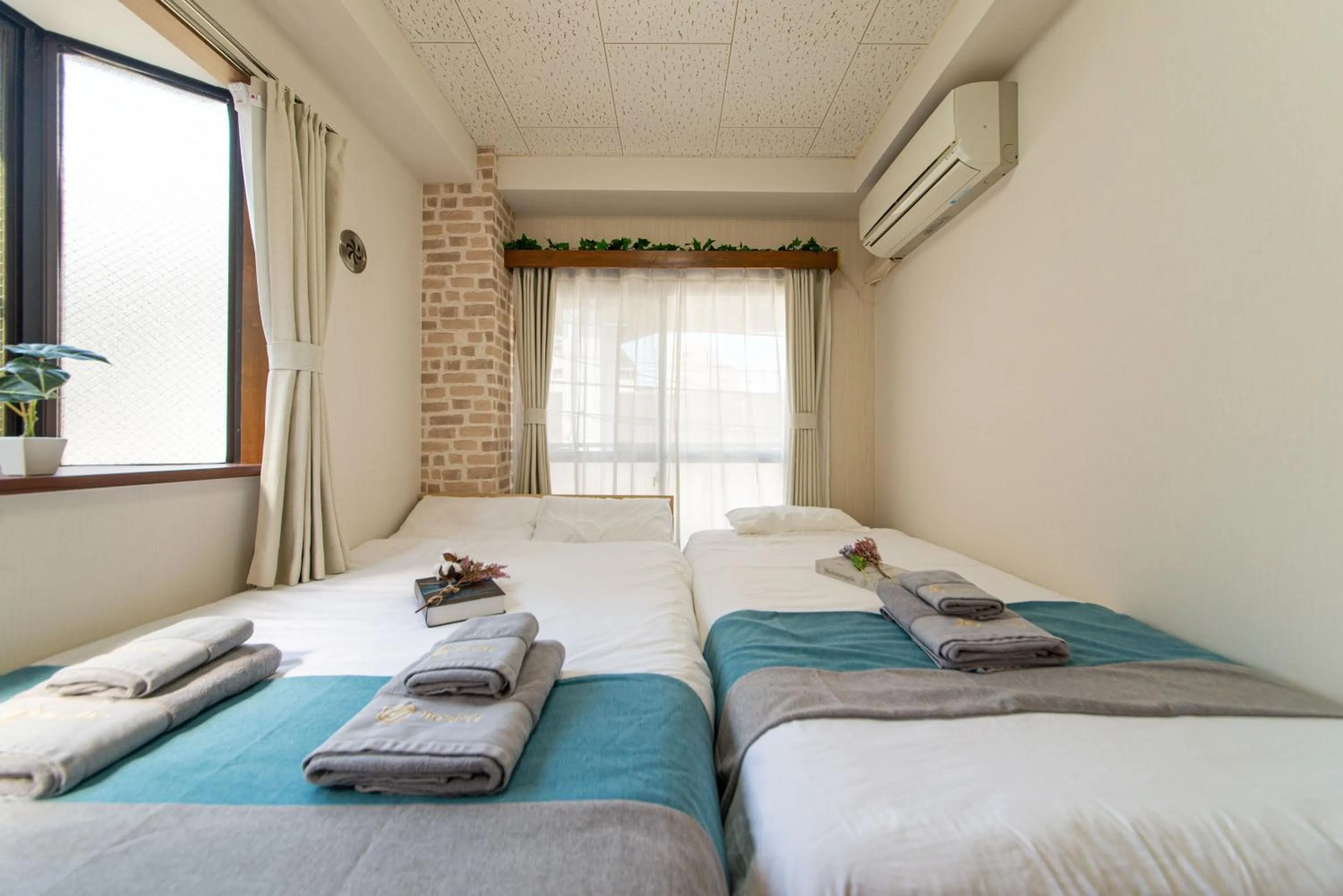 Bed in nestay suite tokyo tabata