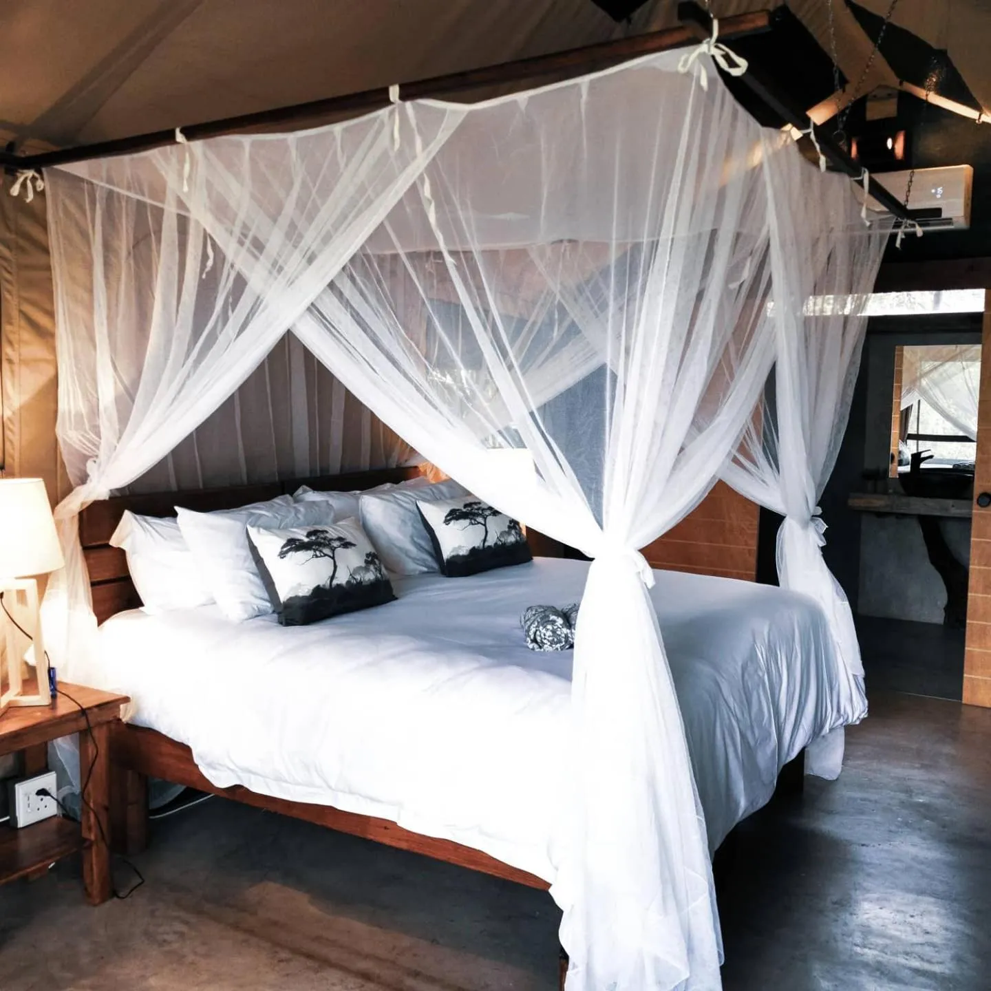 Bed in Little Africa Safari Lodge