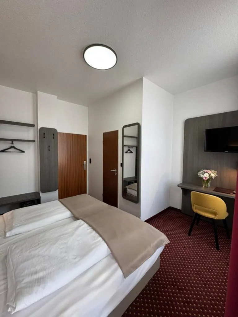 Bed in Hotel Lumen am Hauptbahnhof