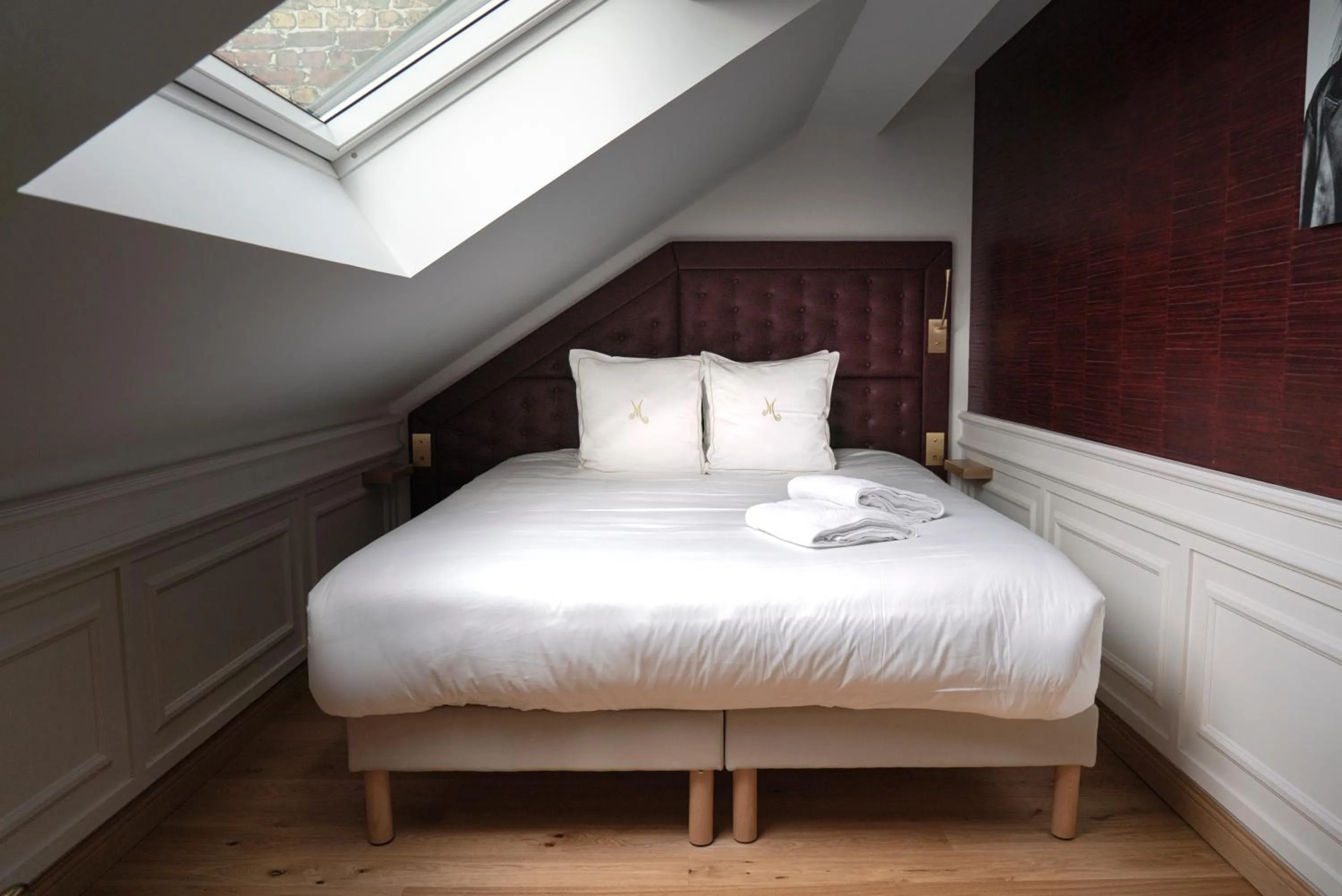 Bed in Hôtel Merveilleux Côté Mer