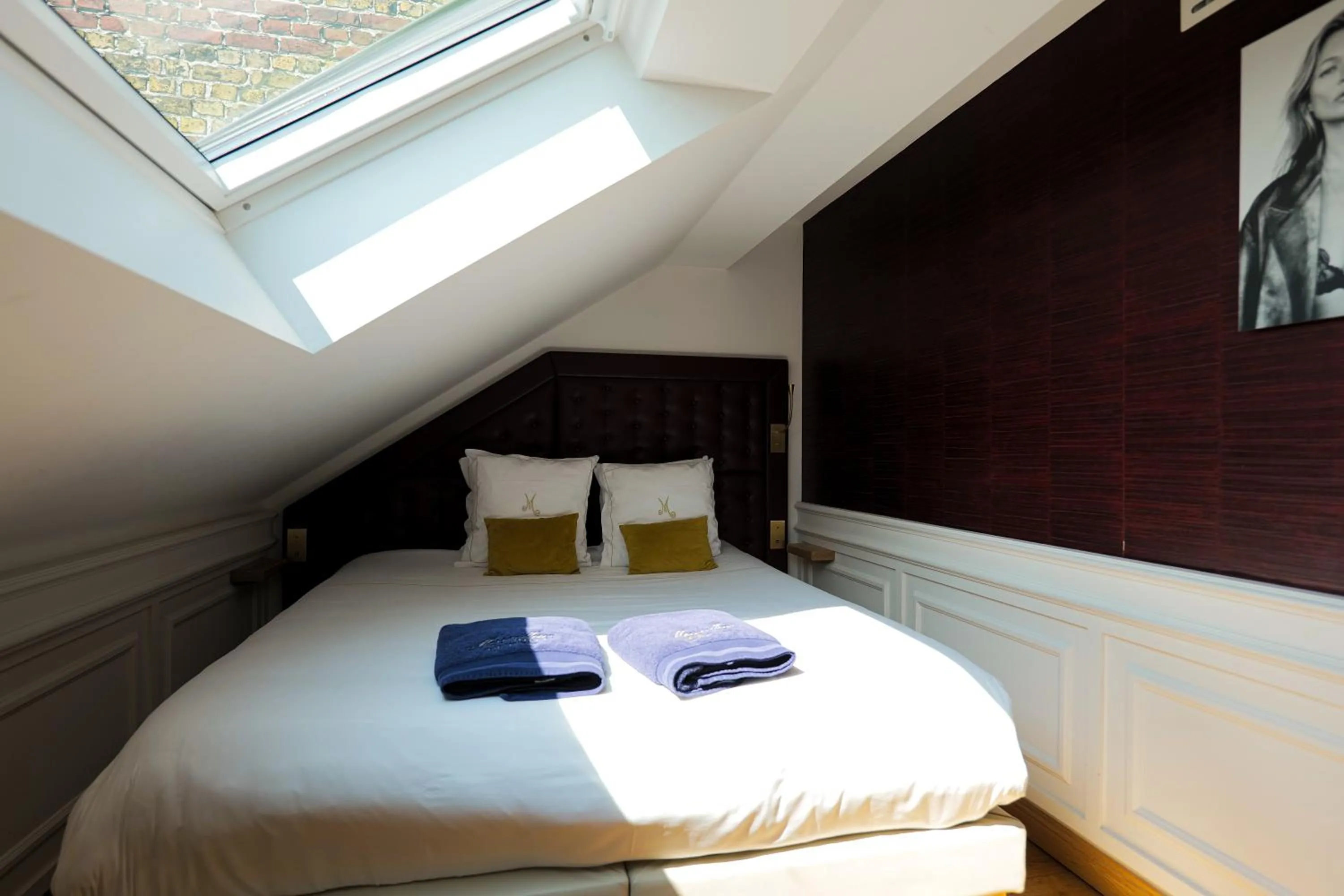 Bed in Hôtel Merveilleux Côté Mer